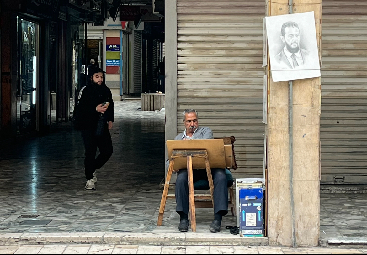 A street artist in the al-Salhiye souk in Damascus. [Justin Salhani/Al Jazeera]