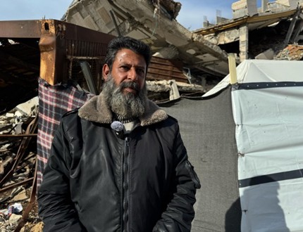 A Palestinian father taking shelter in a tent in Gaza City.