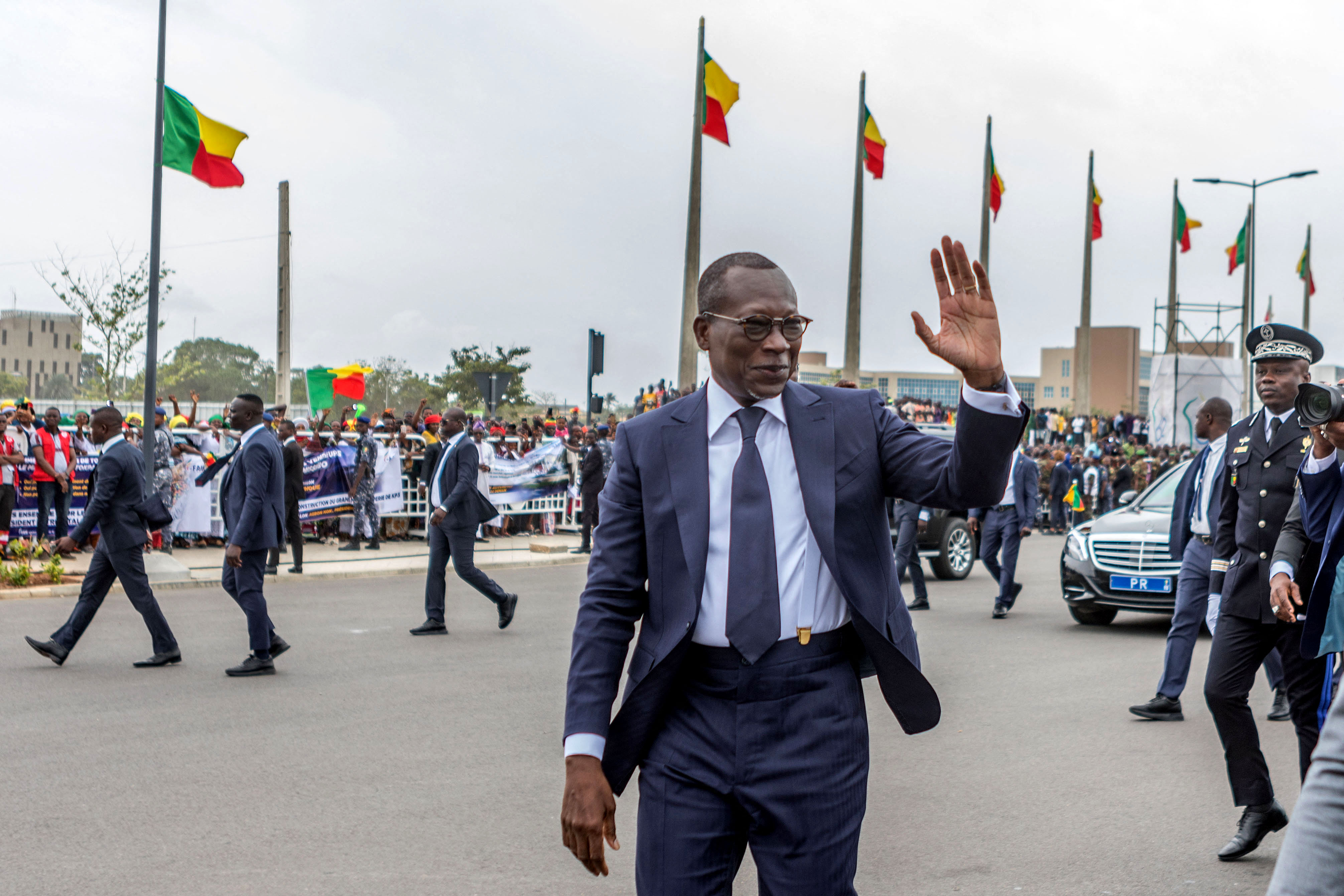 (FILES) Benin's president Patrice Talon waves upon his arrival to inspect a guard of honour during the celebrations marking the 62nd independence anniversary in Cotonou, on August 1, 2022.