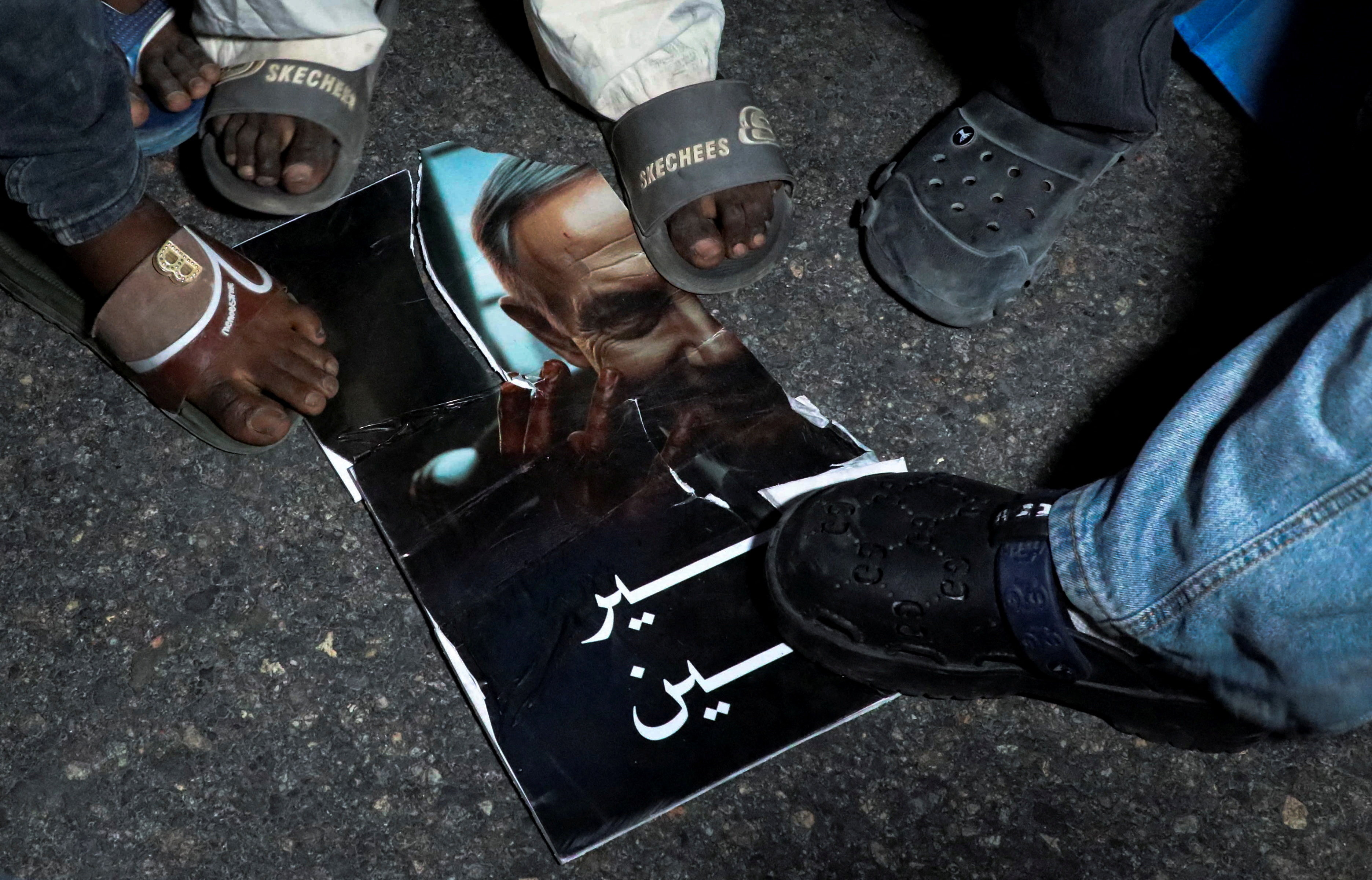 Somalis step on a torn image depicting Israeli Prime Minister Benjamin Netanyahu during a demonstration after Israel became the first country to formally recognise the self-declared Republic of Somaliland as an independent and sovereign state, a decision that could reshape regional dynamics and test Somalia's longstanding opposition to secession, in Hodan district of Mogadishu, Somalia, December 28, 2025. REUTERS/Feisal Omar TPX IMAGES OF THE DAY