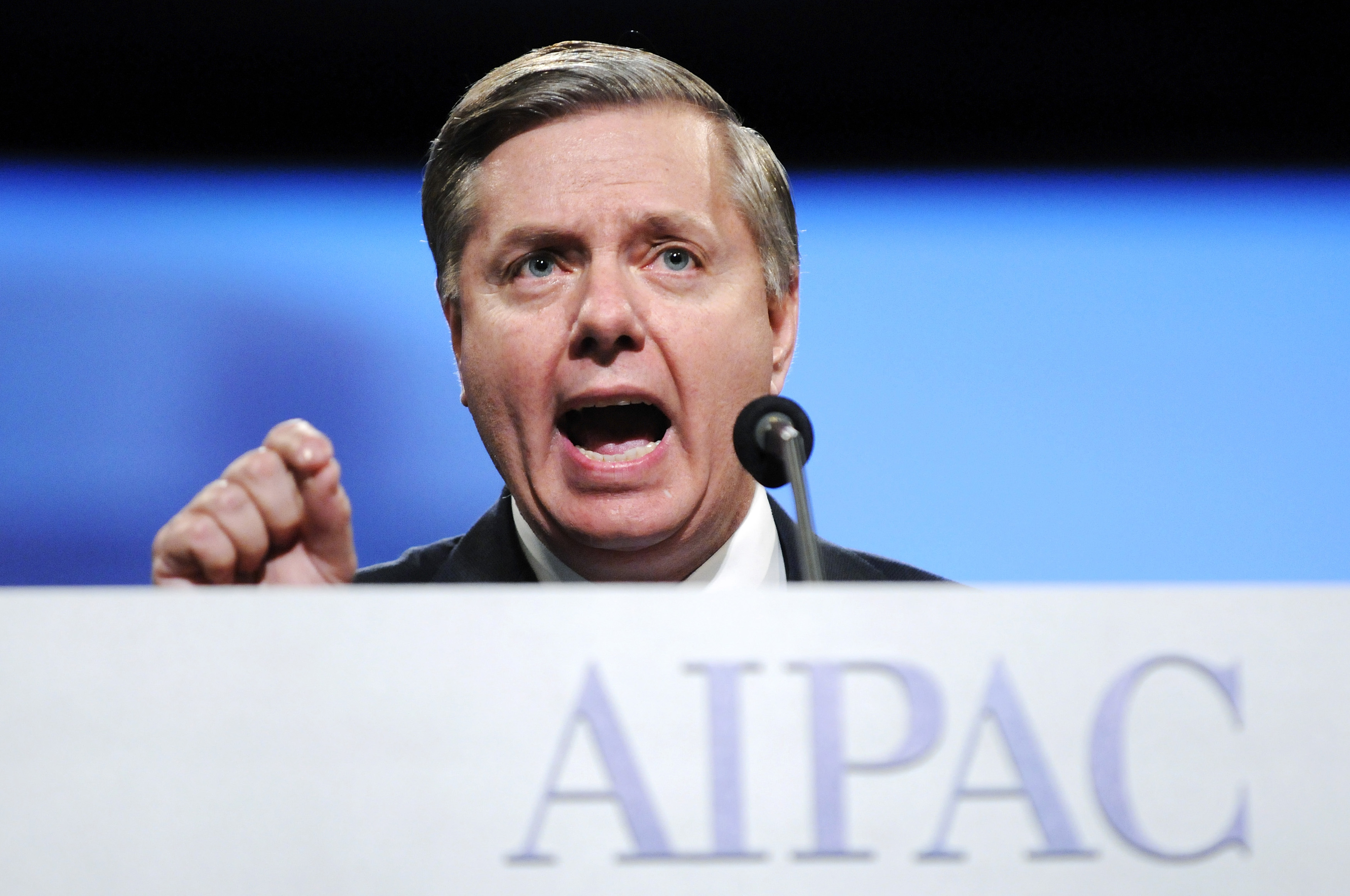 US Senator Graham gestures as he addresses the gala banquet of the AIPAC annual policy conference in Washington