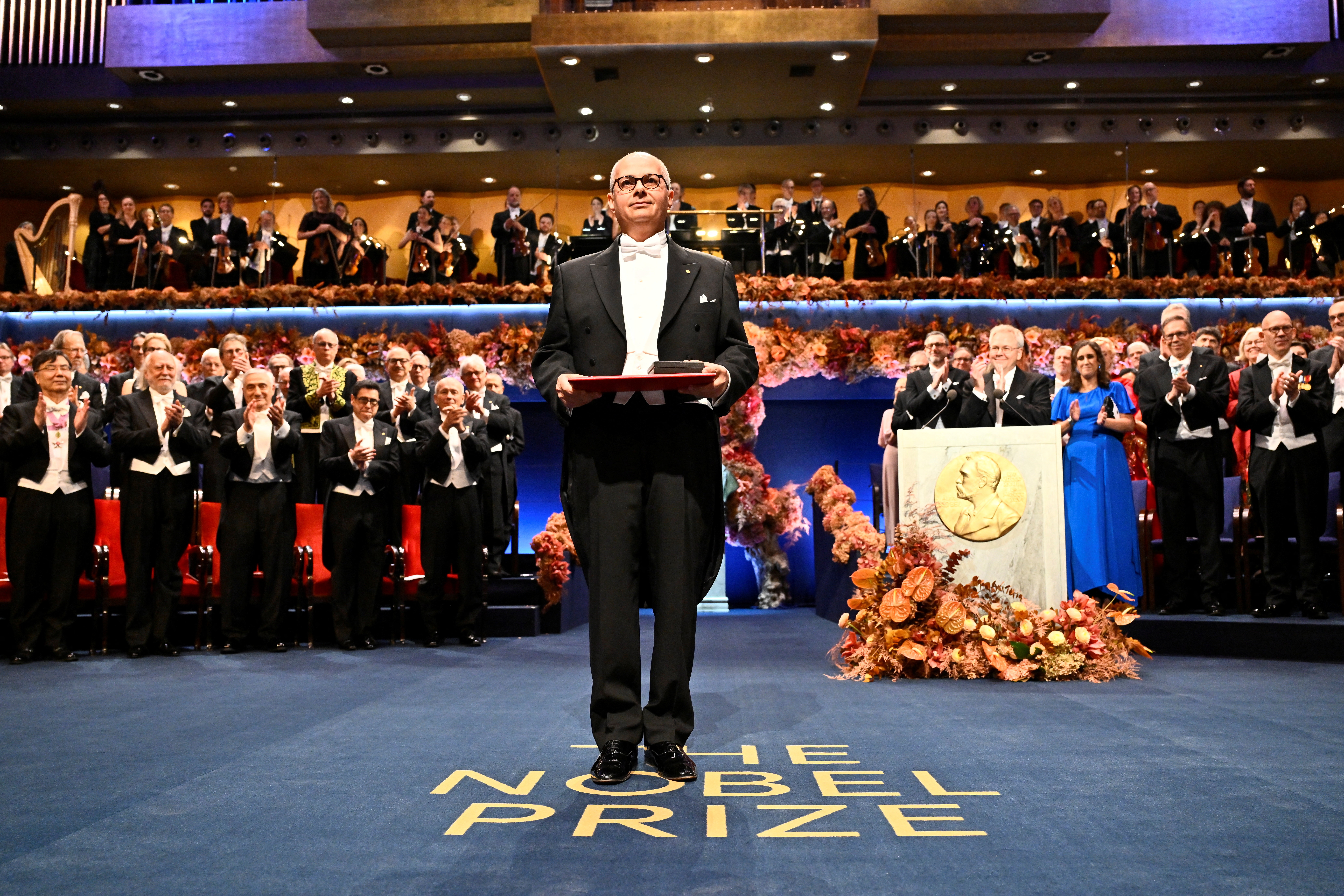 Nobel laureate in chemistry Omar M. Yaghi stands with his prize during the Nobel Prize ceremony at the Concert Hall in Stockholm, Sweden, December 10, 2025. Henrik Montgomery/TT News Agency/via REUTERS