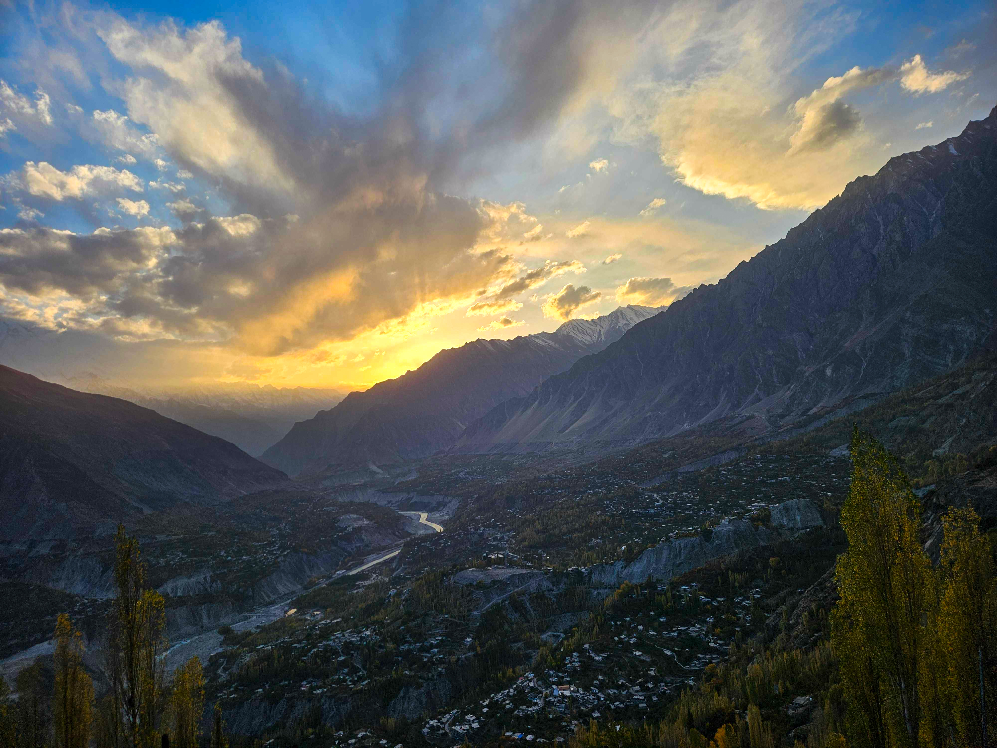 The sun sets behind the Karakoram mountain range, as seen from Karimabad in Hunza valley, Pakistan [Hafsa Adil/Al Jazeera]