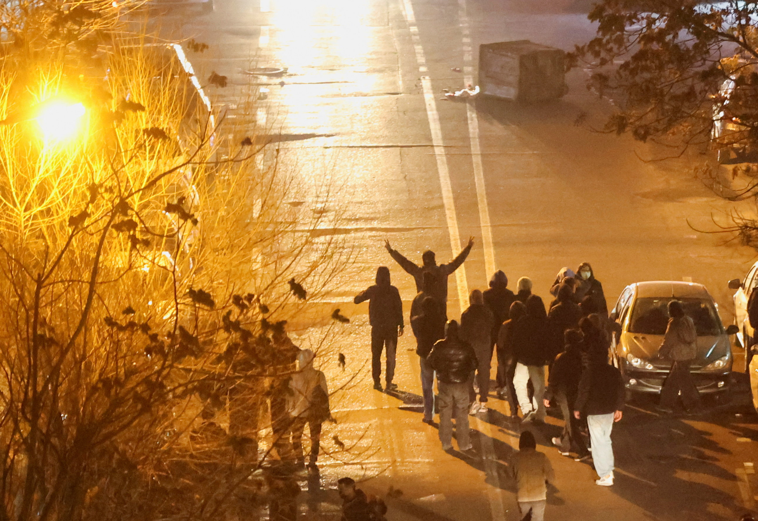 Iranian demonstrators gather in a street during a protest over the collapse of the currency's value, in Tehran, Iran, January 8, 2026