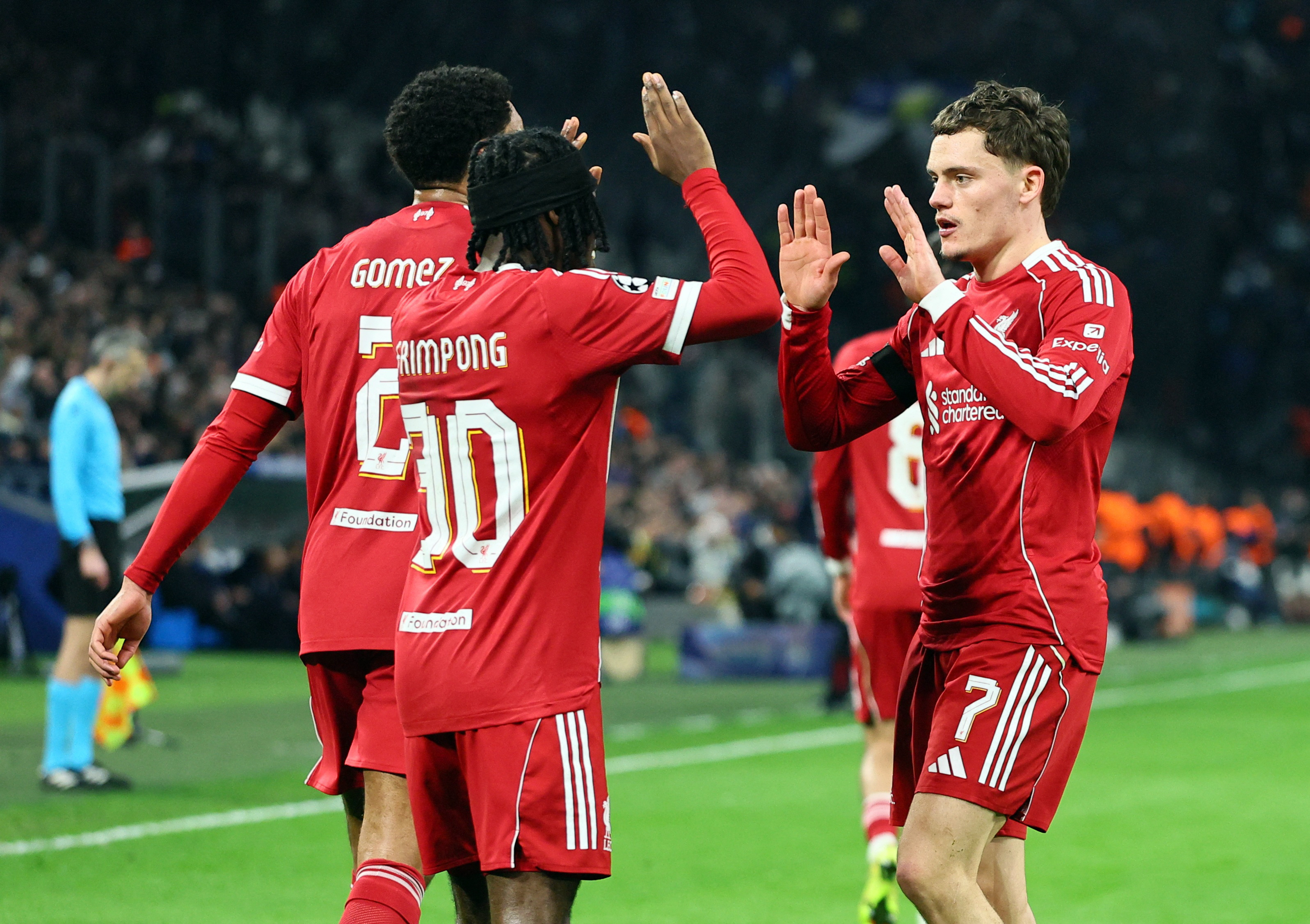 Liverpool's Jeremie Frimpong celebrates scoring their second goal with Florian Wirtz
