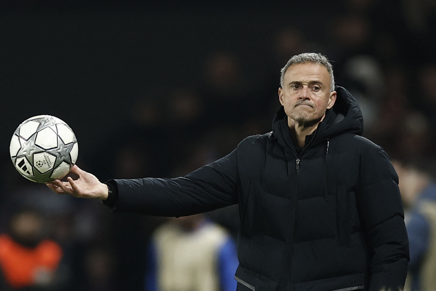 Paris St Germain coach Luis Enrique holding a match ball 