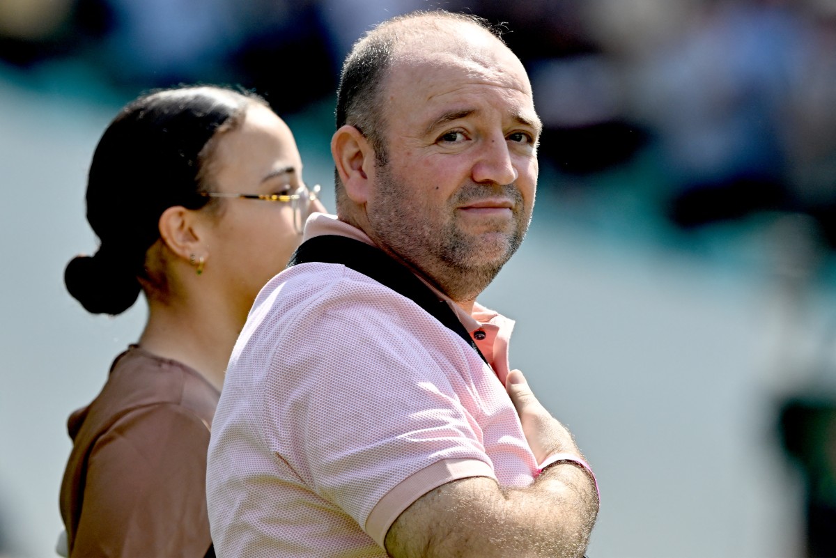 Ahmed al-Ahmed, the man who tackled and disarmed one of the Bondi beach attackers, stands for the national anthems alongside other first responders after receiving a guard of honour for their service, before the fifth Ashes cricket Test match