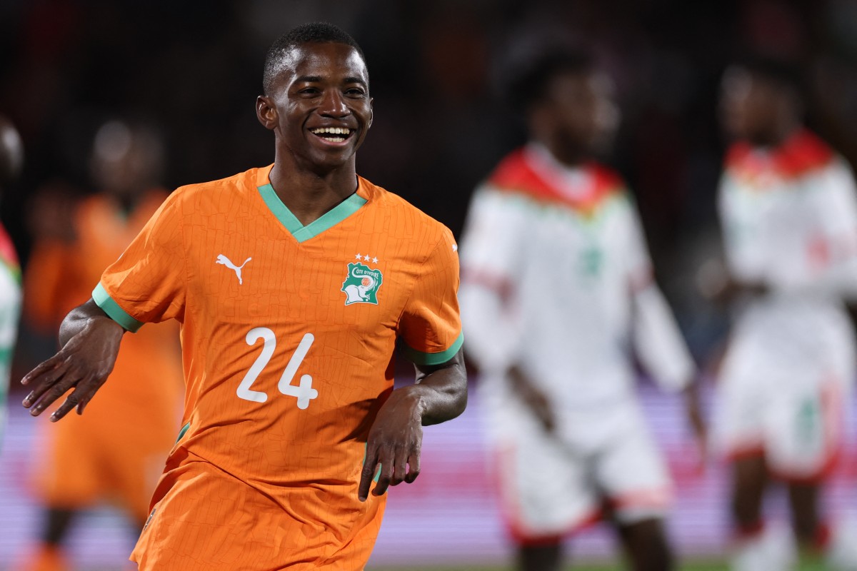 Ivory Coast's forward #24 Bazoumana Toure celebrates scoring the team's third goal during the Africa Cup of Nations (CAN) round of 16 football match between Ivory Coast and Burkina Faso