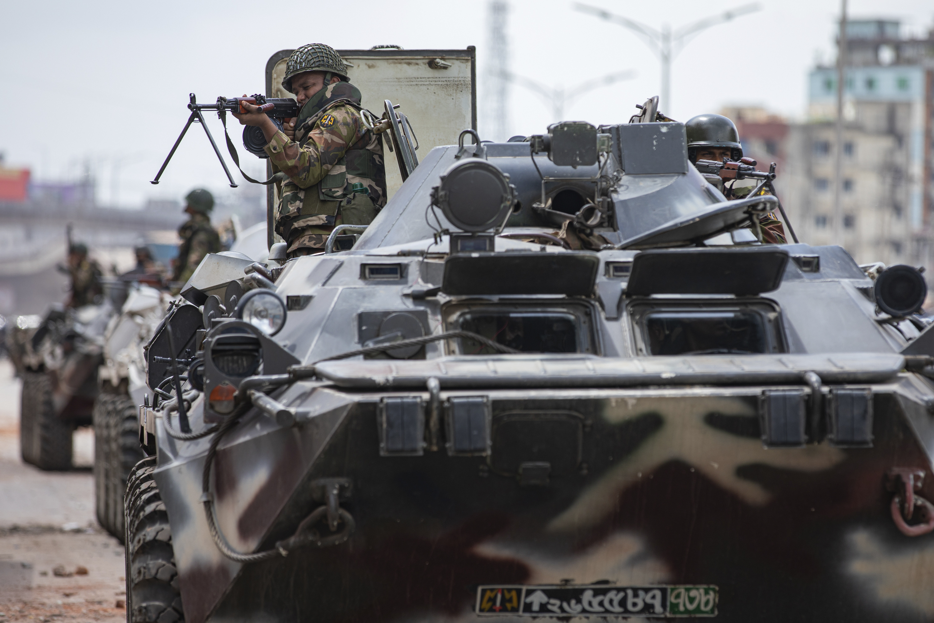 Bangladeshi military force soldiers on armored vehicles patrol the streets of Dhaka, Bangladesh, Saturday, July 20, 2024. (AP Photo/Rajib Dhar)