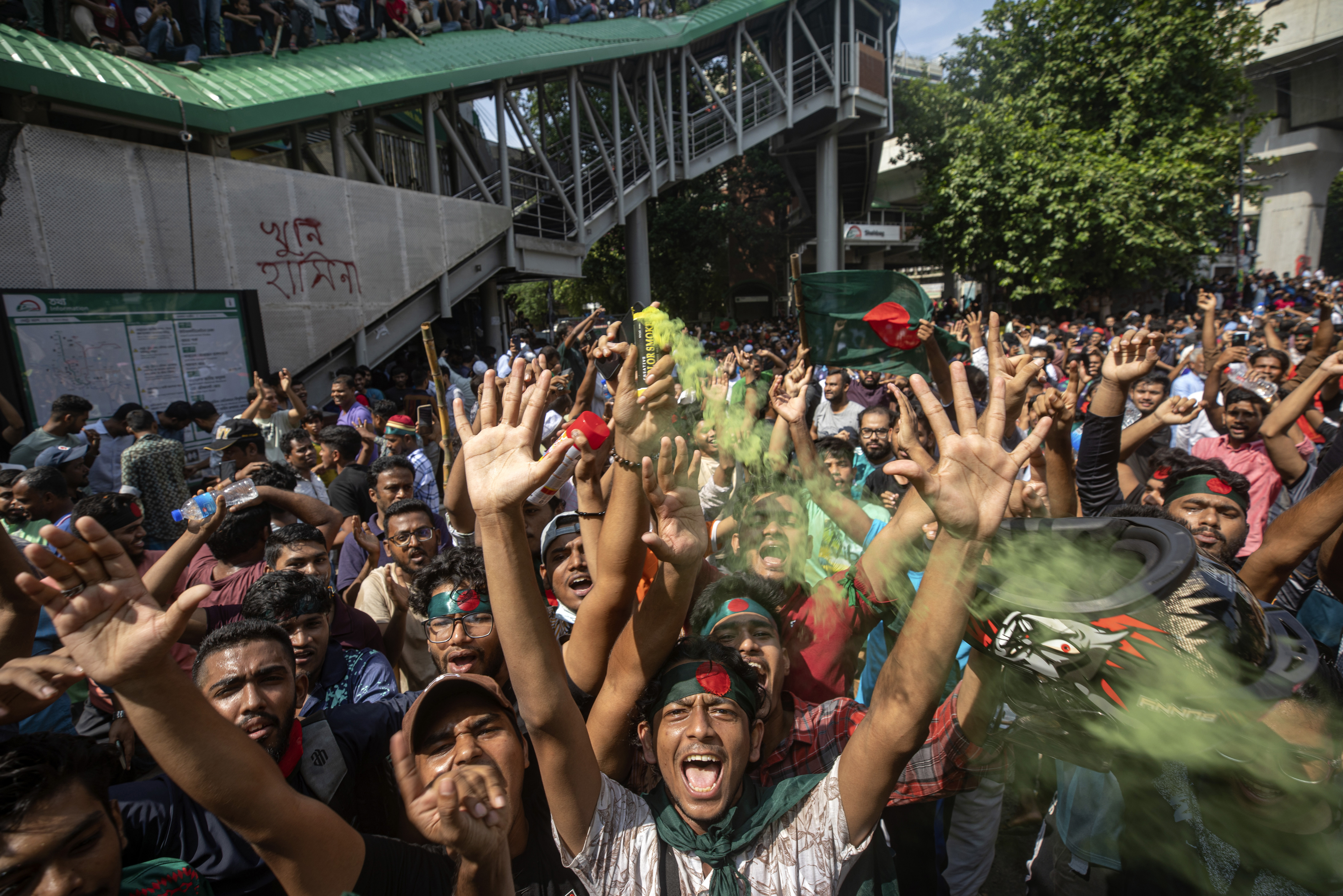 FILE- Protesters shout slogans as they celebrate Prime Minister Sheikh Hasina's resignation, in Dhaka, Bangladesh, Monday, Aug. 5, 2024. (AP Photo/Rajib Dhar, File)