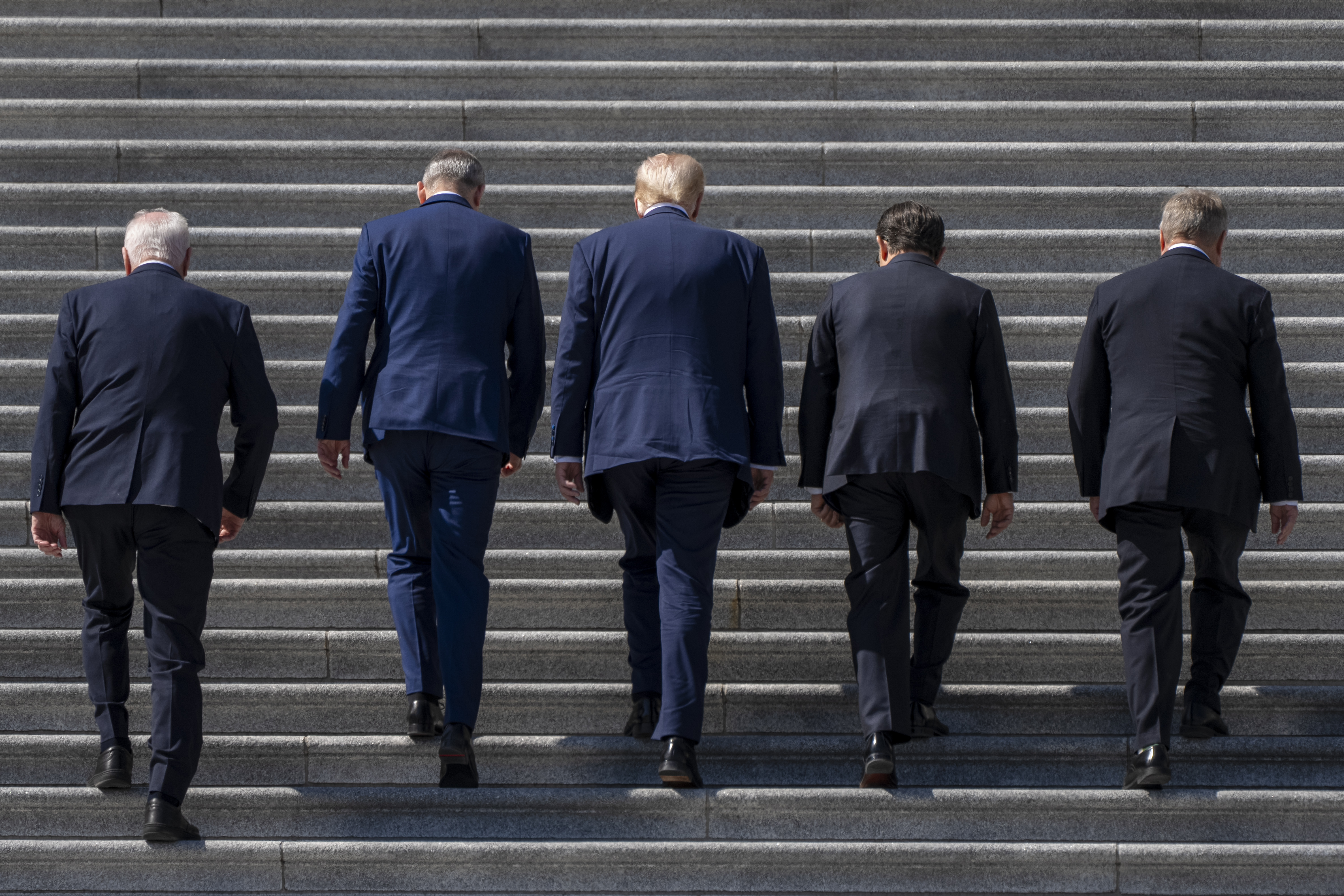 Donald Trump, Mike Johnson, Micheal Martin and other figures climb the Capitol steps
