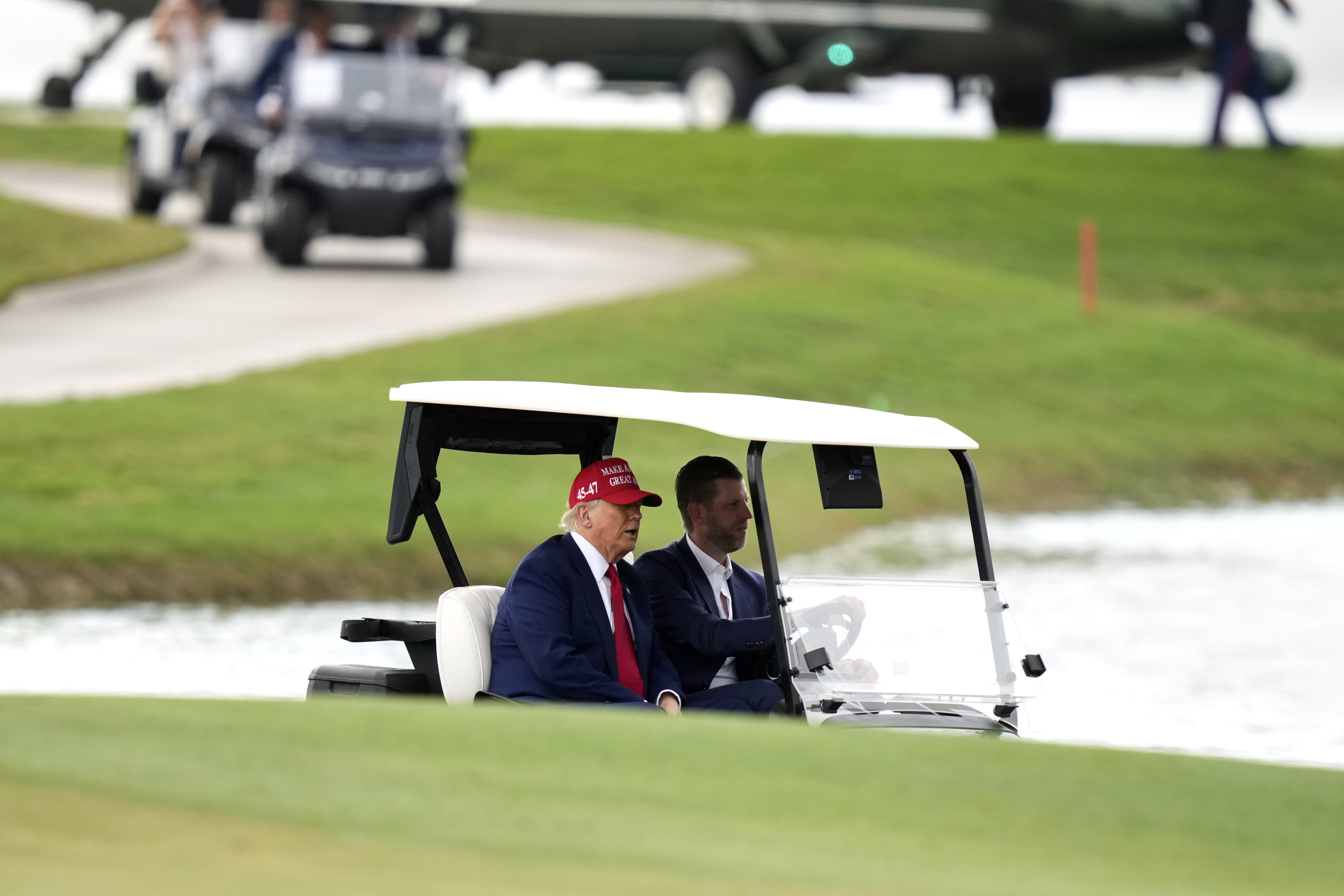 Trump rides in a golf cart