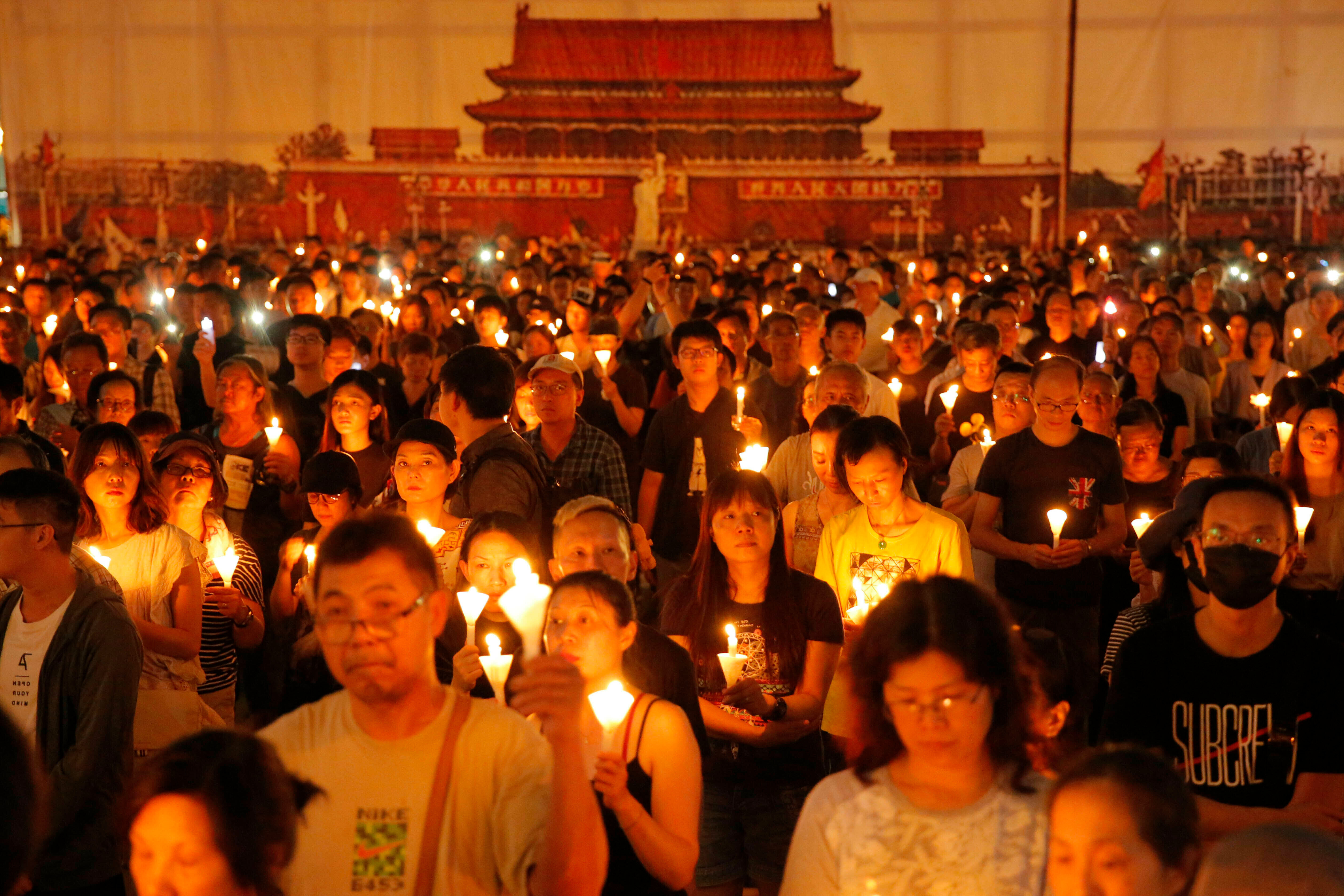 Thousands of people attend a candlelight vigil for victims of the Chinese government's military crackdown on protesters in Tiananmen Square, in Hong Kong in June 2019