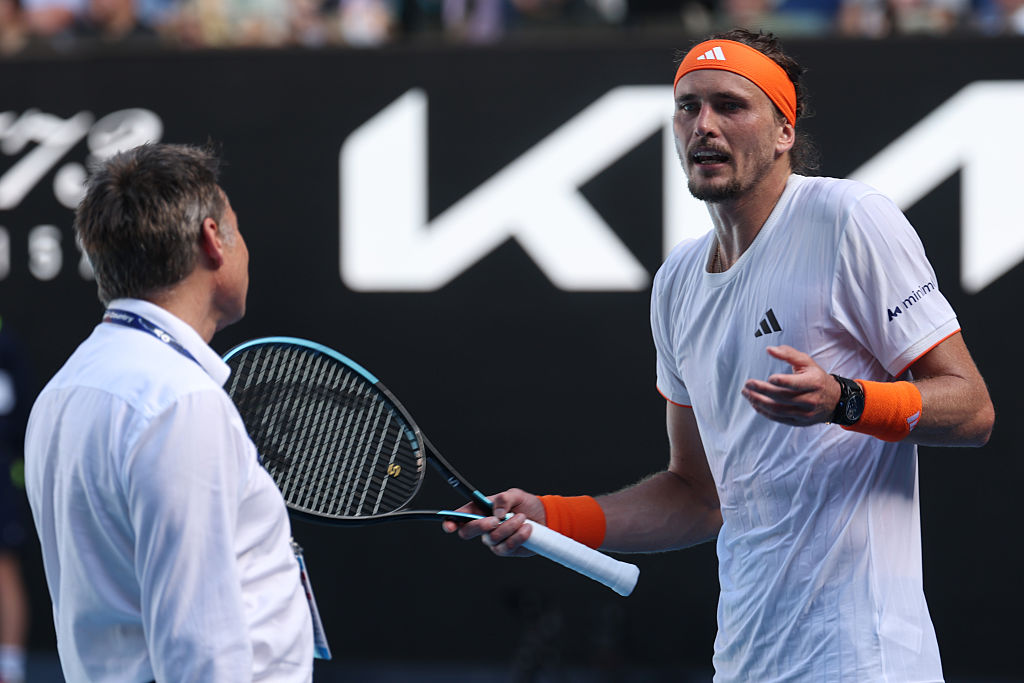 Alexander Zverev of Germany talks to the Grand Slam Supervisor Andreas Egli in the Men's Singles Semifinal match against Carlos Alcaraz of Spain