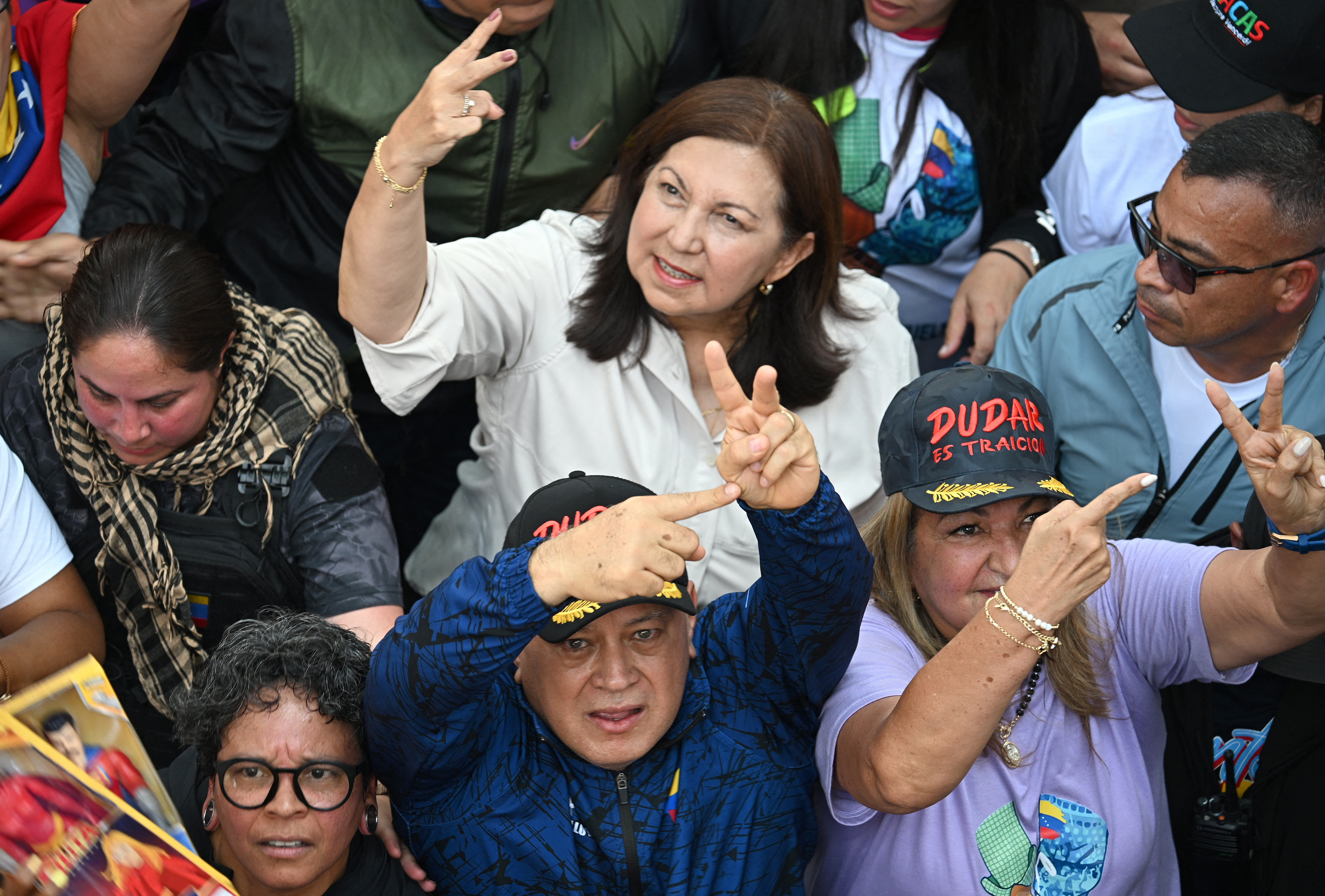 Venezuela's Minister of Interior Diosdado Cabello gestures a V for victory with his hands during a women's rally in support of ousted Venezuela's President Nicolas Maduro and his wife Cilia Flores in Caracas on January 6, 2026.