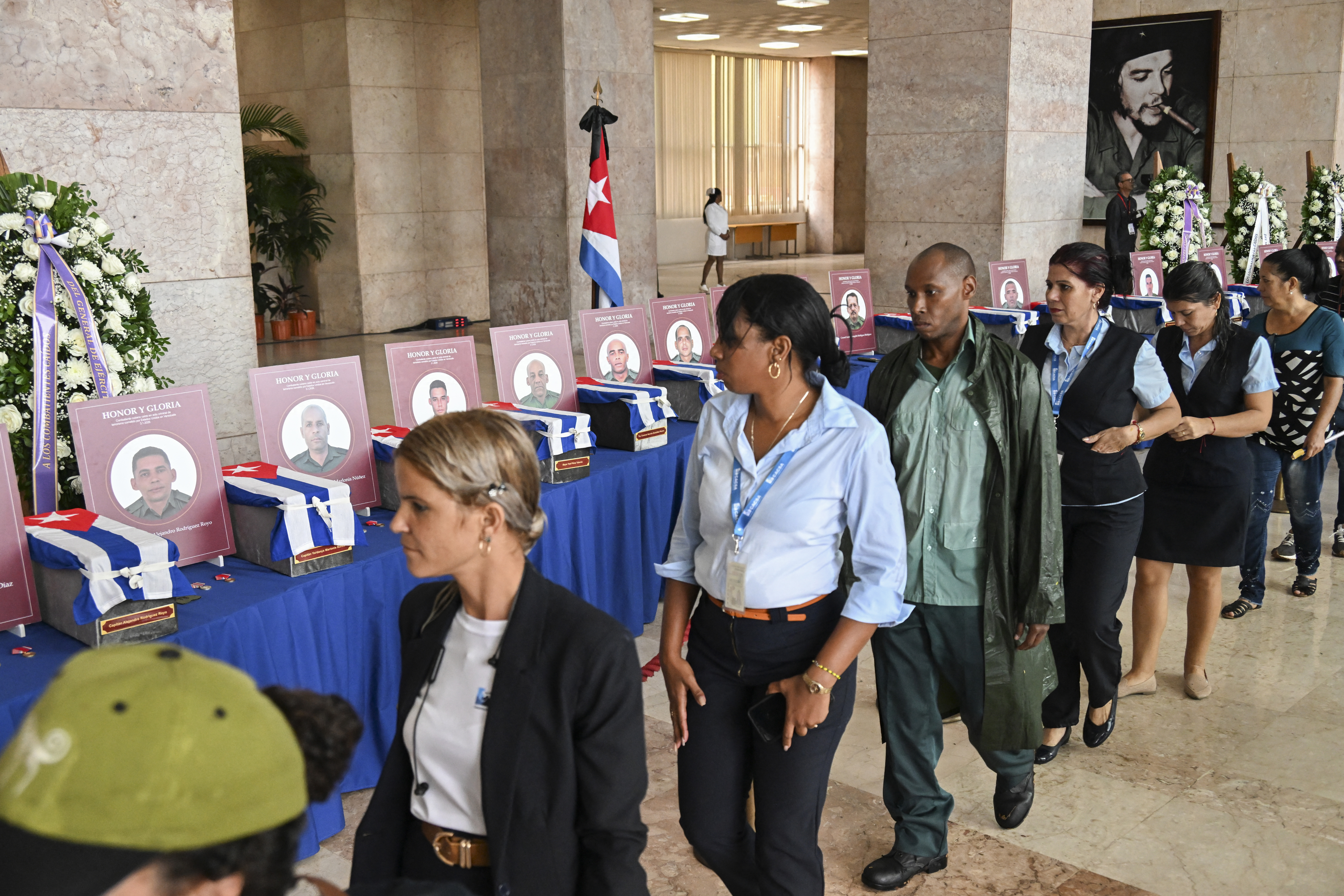 Cubans pay their respects during the funeral honors of the 32 Cuban soldiers who died during the US incursion to capture Venezuelan leader Nicolas Maduro, at the Ministry of the Revolutionary Armed Forces in Havana on January 15, 2026.