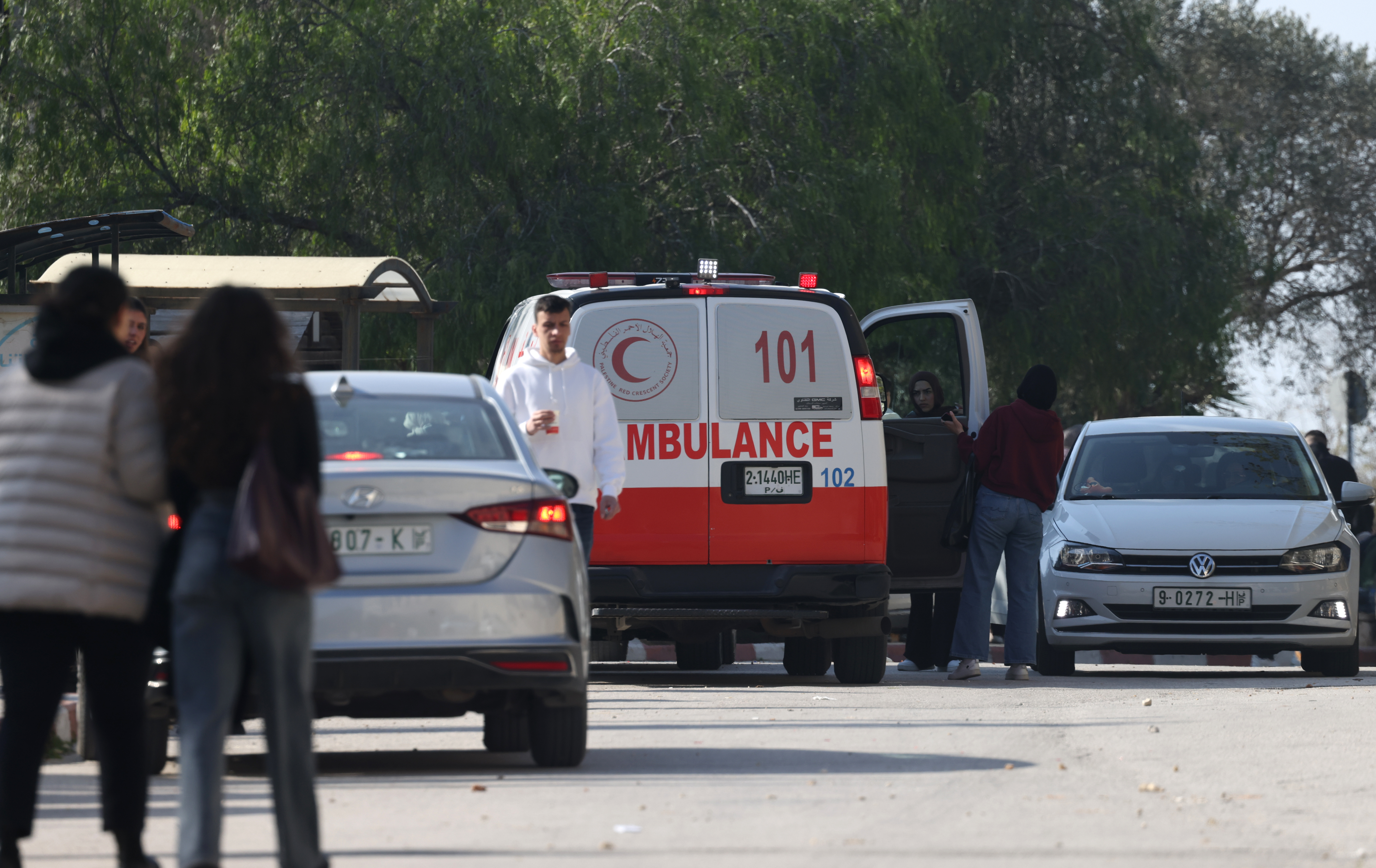 epa12630761 epa12630733 People walk past an ambulance after Palestinian students were injured during an Israeli military raid on the Birzeit University campus near Ramallah, West Bank, 06 January 2026. According to the Palestinian Health Ministry and Palestinian Red Crescent Society, at least 11 students were wounded after Israeli forces stormed the campus on 06 January. EPA/ALAA BADARNEH EPA/ALAA BADARNEH
