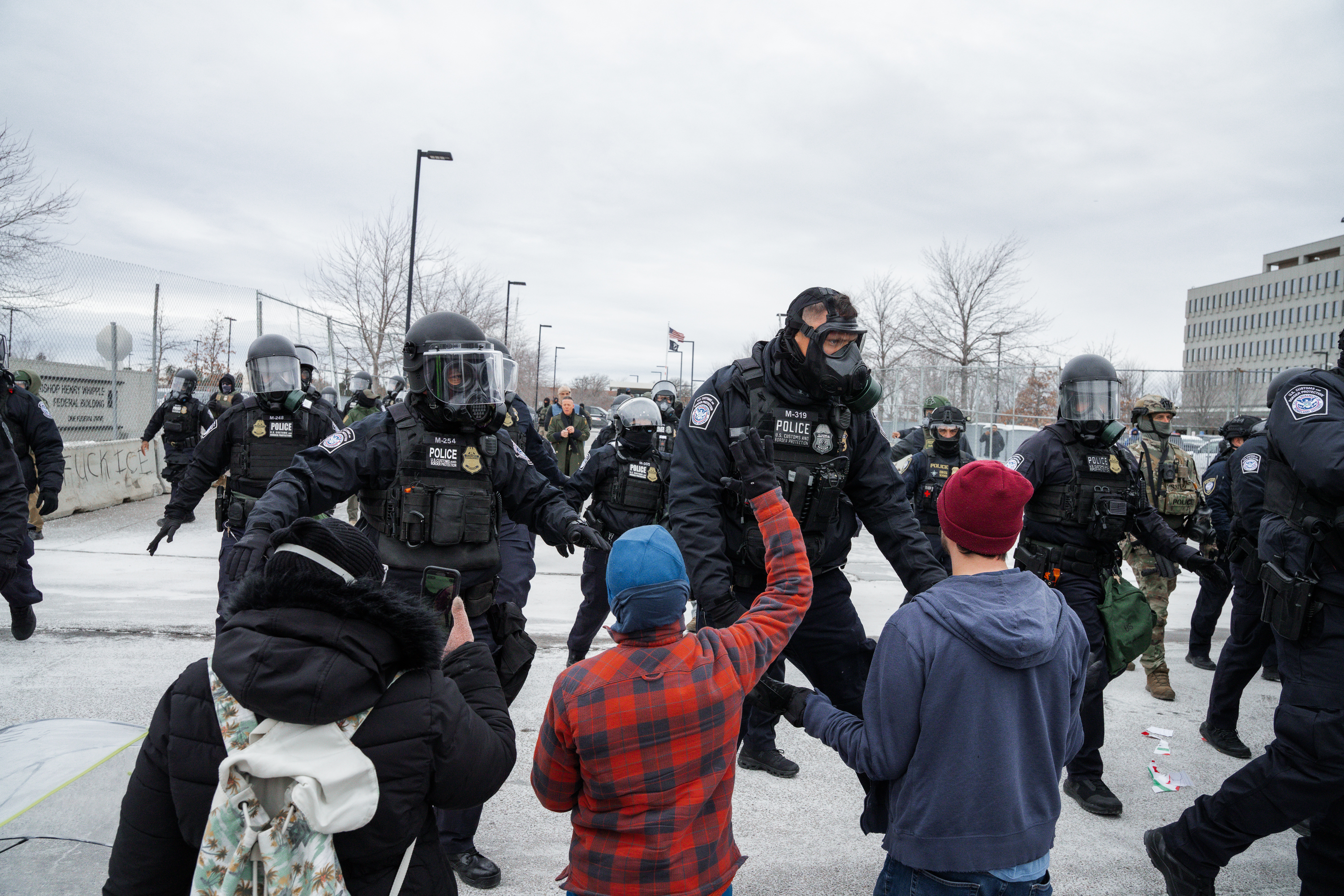 epa12652552 Minneapolis Police Department officers charge at people who kneel in front of them during an anti-ICE protest outside the Whipple Federal Building, a base for federal immigration enforcement operations, in Fort Snelling, Minnesota, USA, 15 January 2026. As part of a federal immigration crackdown involving over 2,000 agents from Border Patrol, Immigration and Customs Enforcement (ICE), and Homeland Security Investigations (HSI), an ICE officer fatally shot US citizen Renee Nicole Good in her vehicle during an operation in South Minneapolis on 07 January 2026. EPA/OLGA FEDOROVA