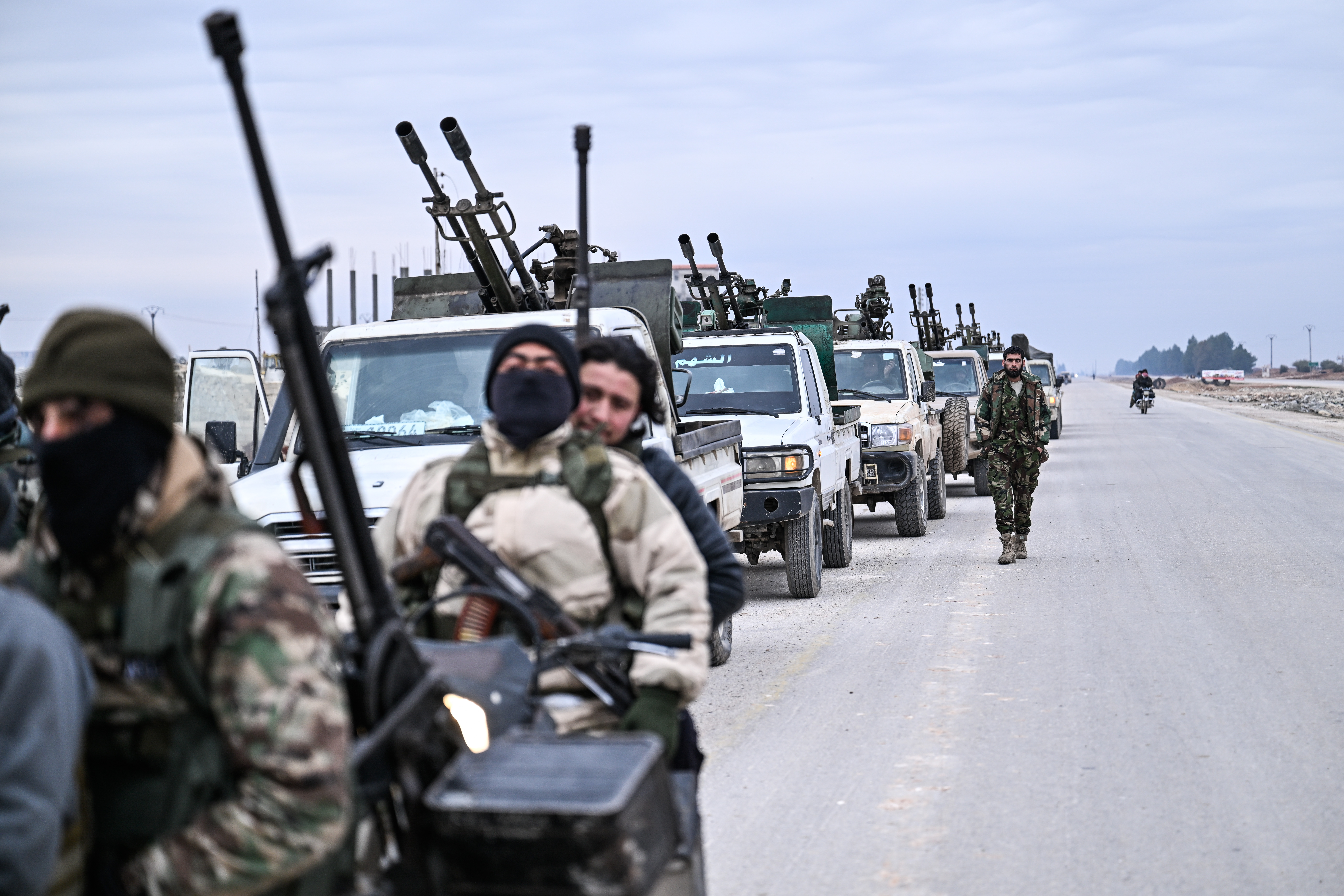 ALEPPO, SYRIA - JANUARY 17: Syrian government military reinforcements arrive via the international M4 highway at Al-Jarrah Military Airport ,east of Aleppo city on January 17, 2026. Syria. Syria's army moved reinforcements east of Aleppo city on January 14, a day after it told Kurdish Syrian Democratic Forces (SDF) to withdraw from the area following deadly clashes last week. The deployment comes as Syria government seeks to extend its authority across the country, but progress has stalled on integrating the Kurds' de facto autonomous administration and forces into the central government under a deal reached in March. (Photo by Abdulmonam Eassa/Getty Images)