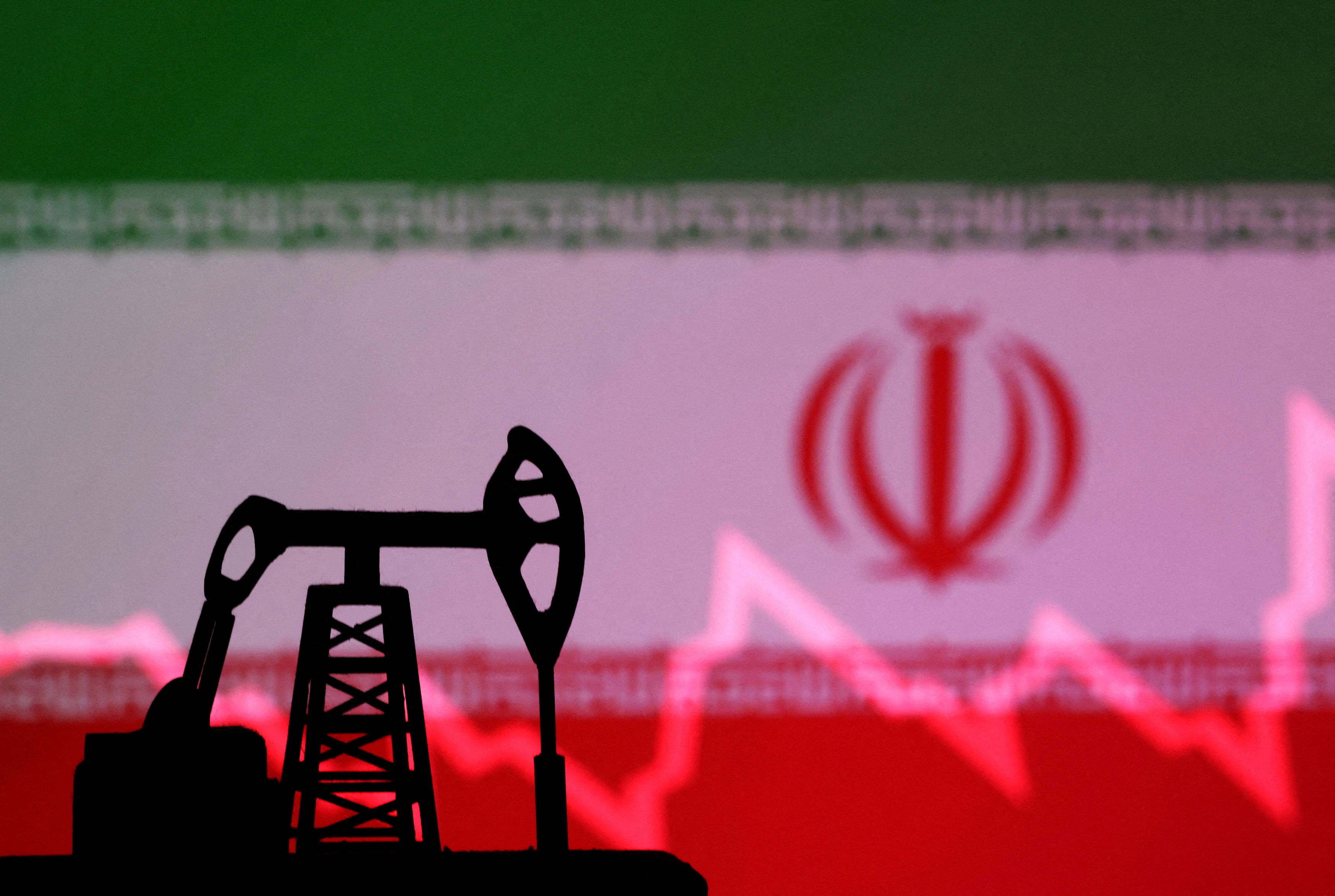 FILE PHOTO: Iranian flag with stock graph and an oil pump jack miniature model are seen in this illustration taken October 9, 2023. REUTERS/Dado Ruvic/Illustration/File Photo