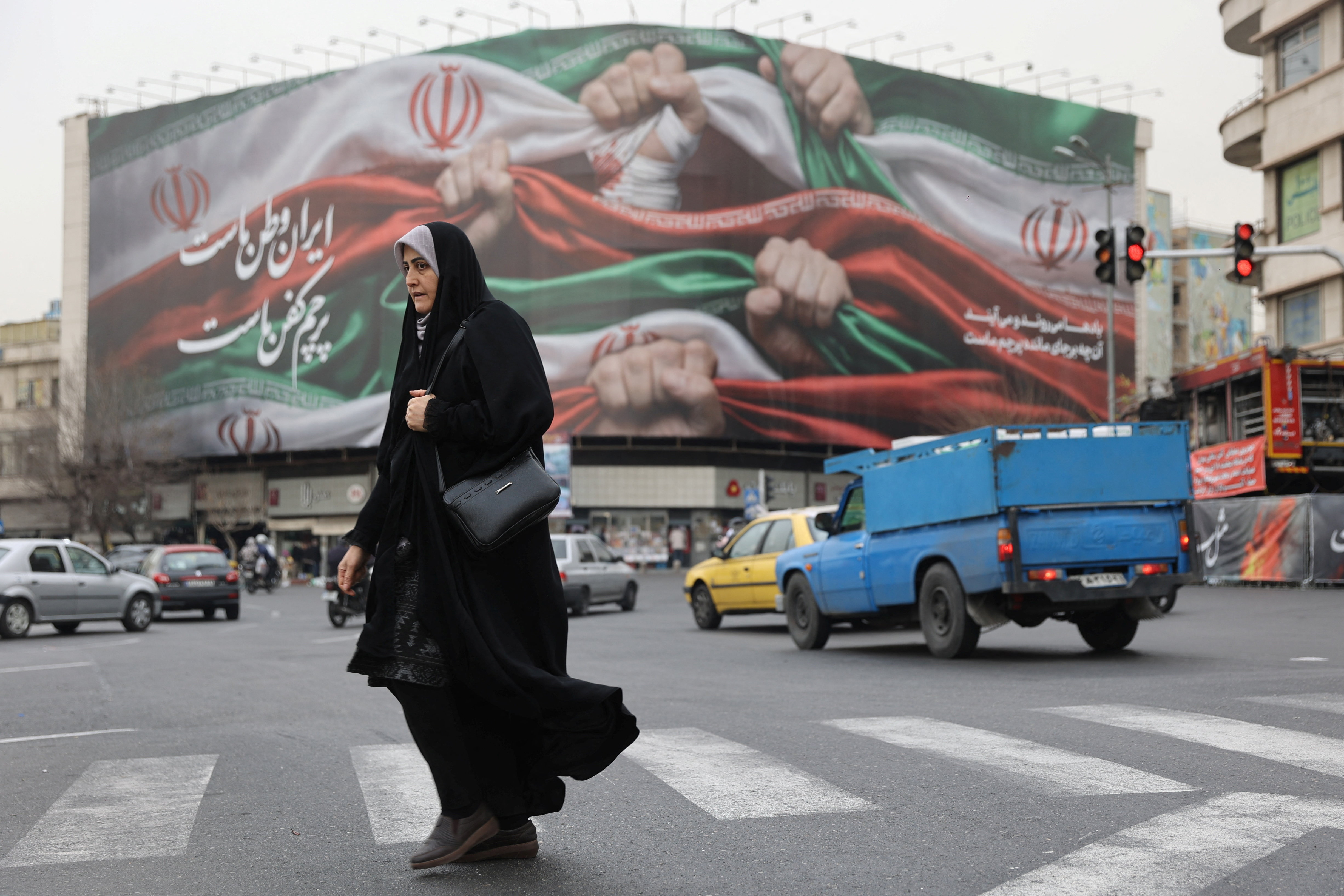 An Iranian woman walks on a street in Tehran, Iran, January 19, 2026. Majid Asgaripour/WANA (West Asia News Agency) via REUTERS ATTENTION EDITORS - THIS PICTURE WAS PROVIDED BY A THIRD PARTY