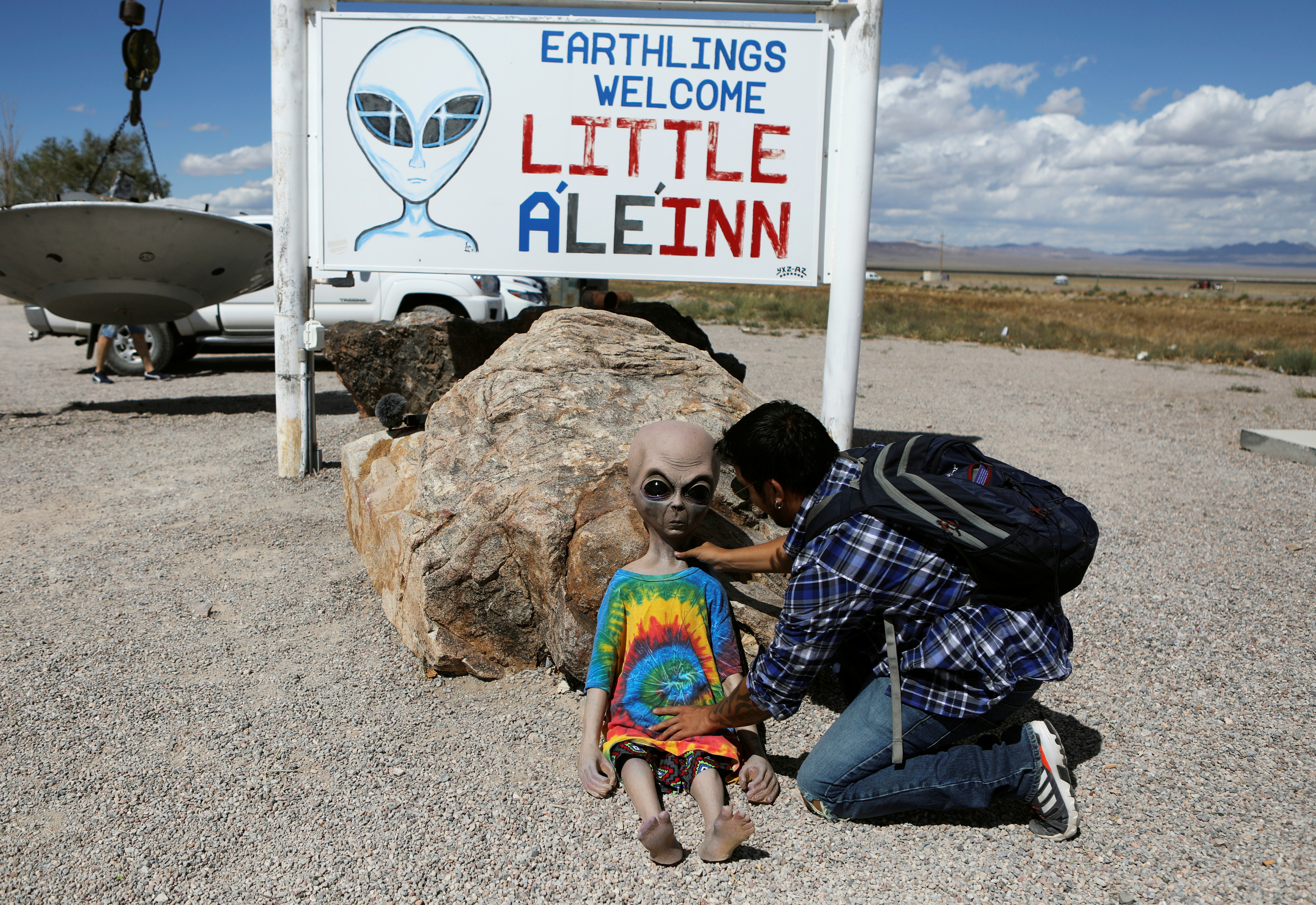 An attendee poses an alien doll at the Little A'Le'Inn as an influx of tourists responding to a call to 'storm' Area 51, a secretive U.S. military base believed by UFO enthusiasts to hold government secrets about extra-terrestrials, is expected in Rachel, Nevada, U.S. September 19, 2019. REUTERS/Jim Urquhart