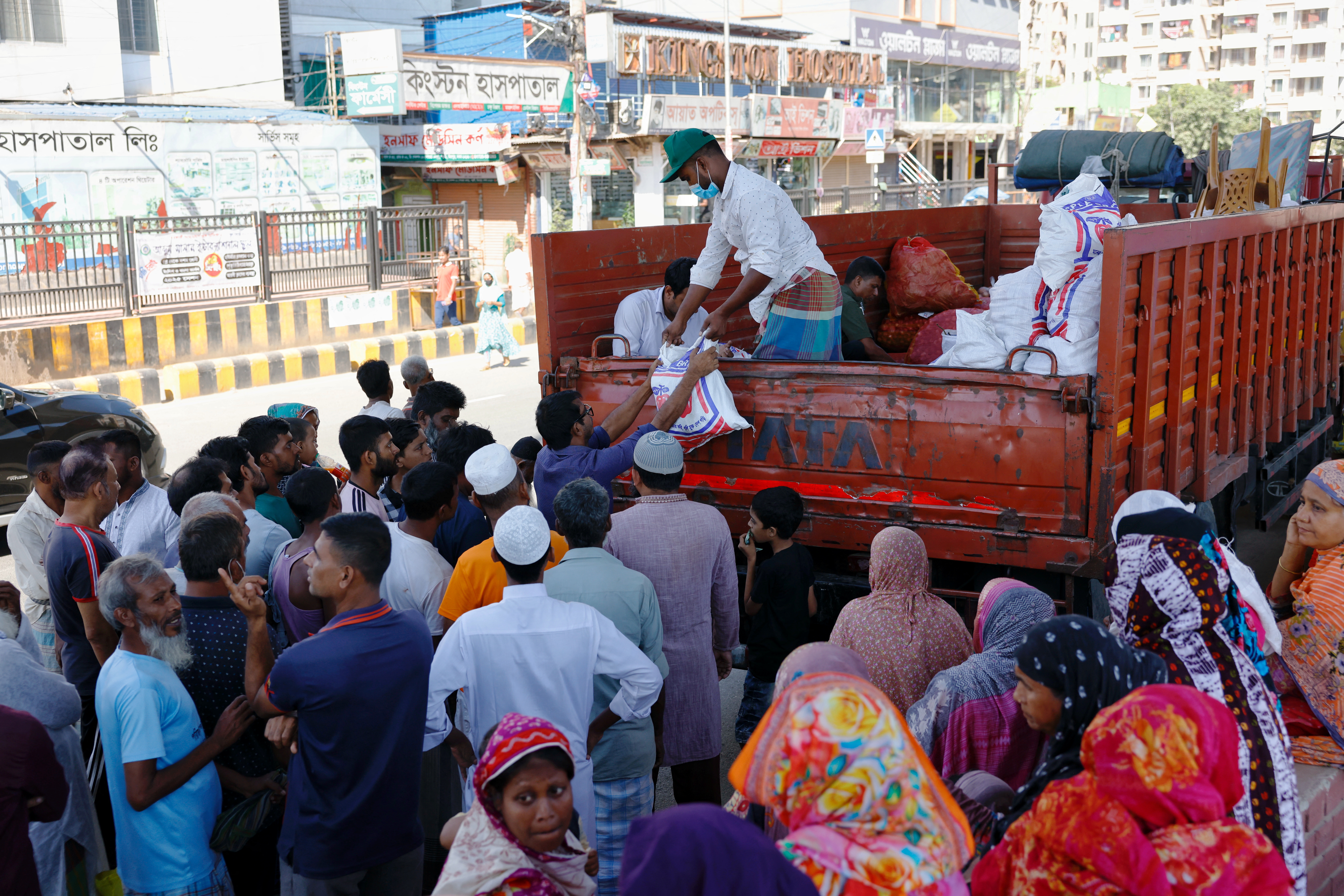 People purchase groceries from a government-subsidised Open Market Sales (OMS) point in Dhaka, Bangladesh, November 11, 2024. REUTERS/Mohammad Ponir Hossain