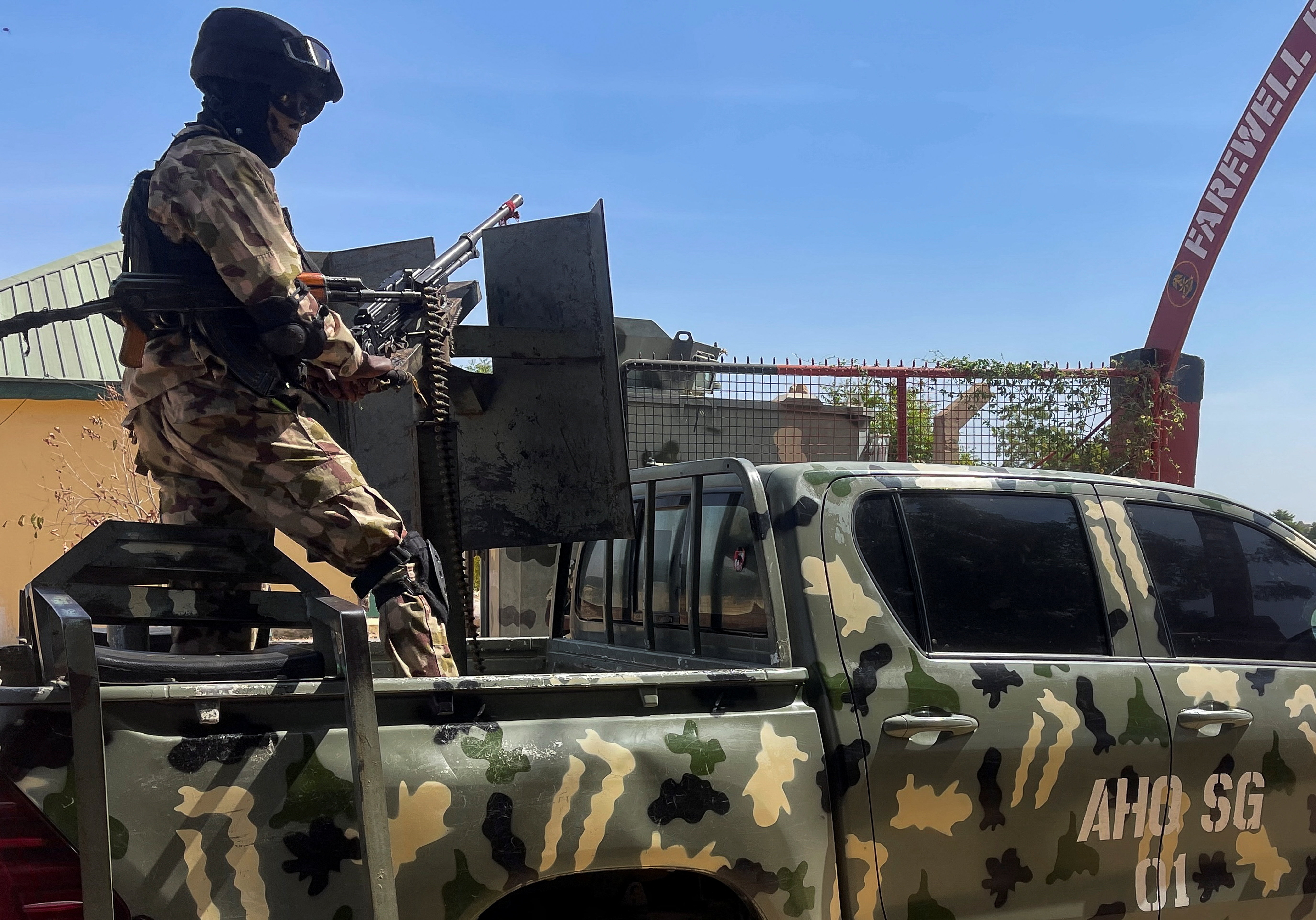 A Nigerian soldier stands on a military truck, during the tour of the Theatre Command Operation Lafiya Dole by Nigeria's Chief of Army Staff, at the Maimalari Cantonment in Maiduguri, Borno, Nigeria, November 7, 2025. REUTERS/Ahmed Kingimi