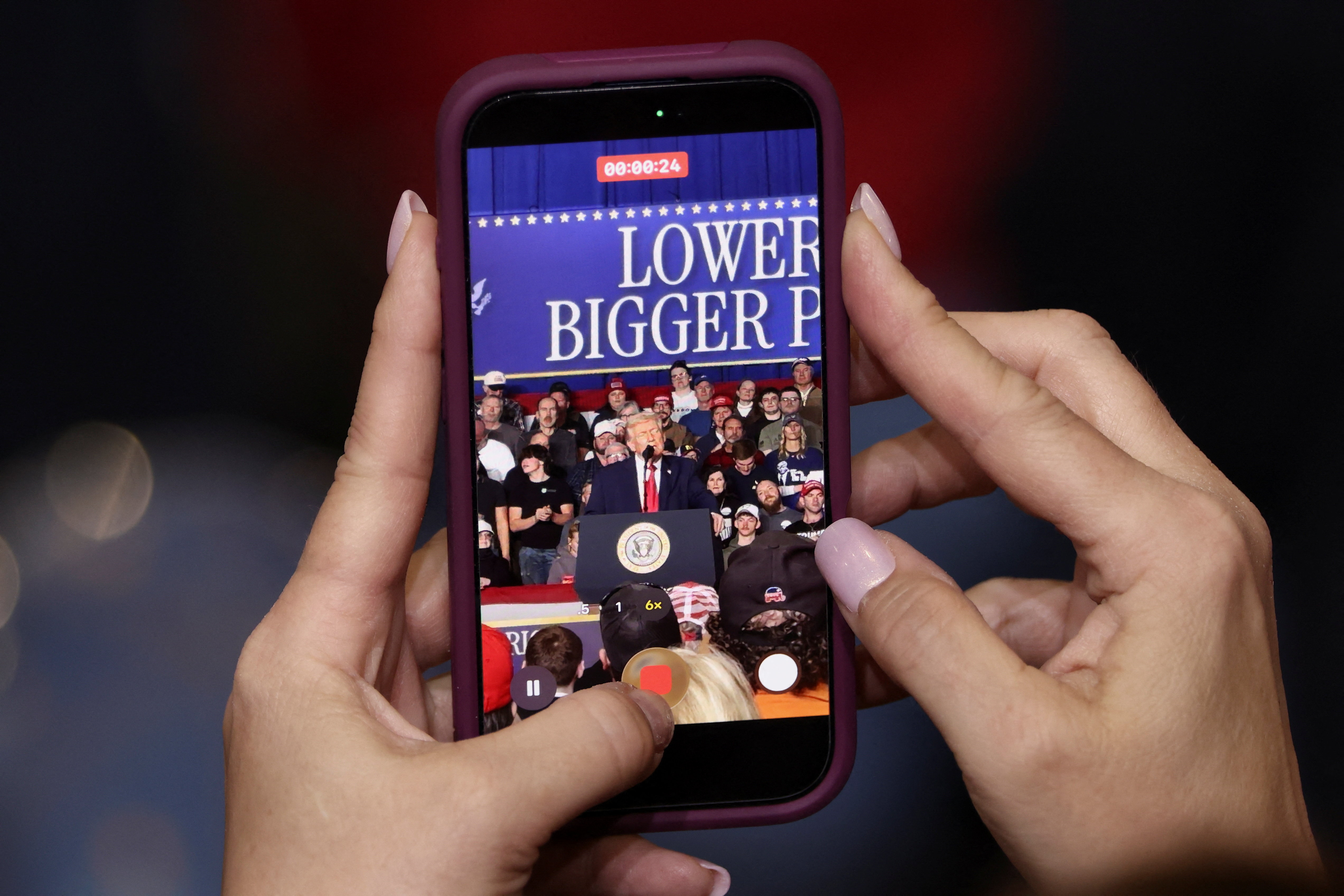 A cellphone records Trump's rally at Clive, Iowa