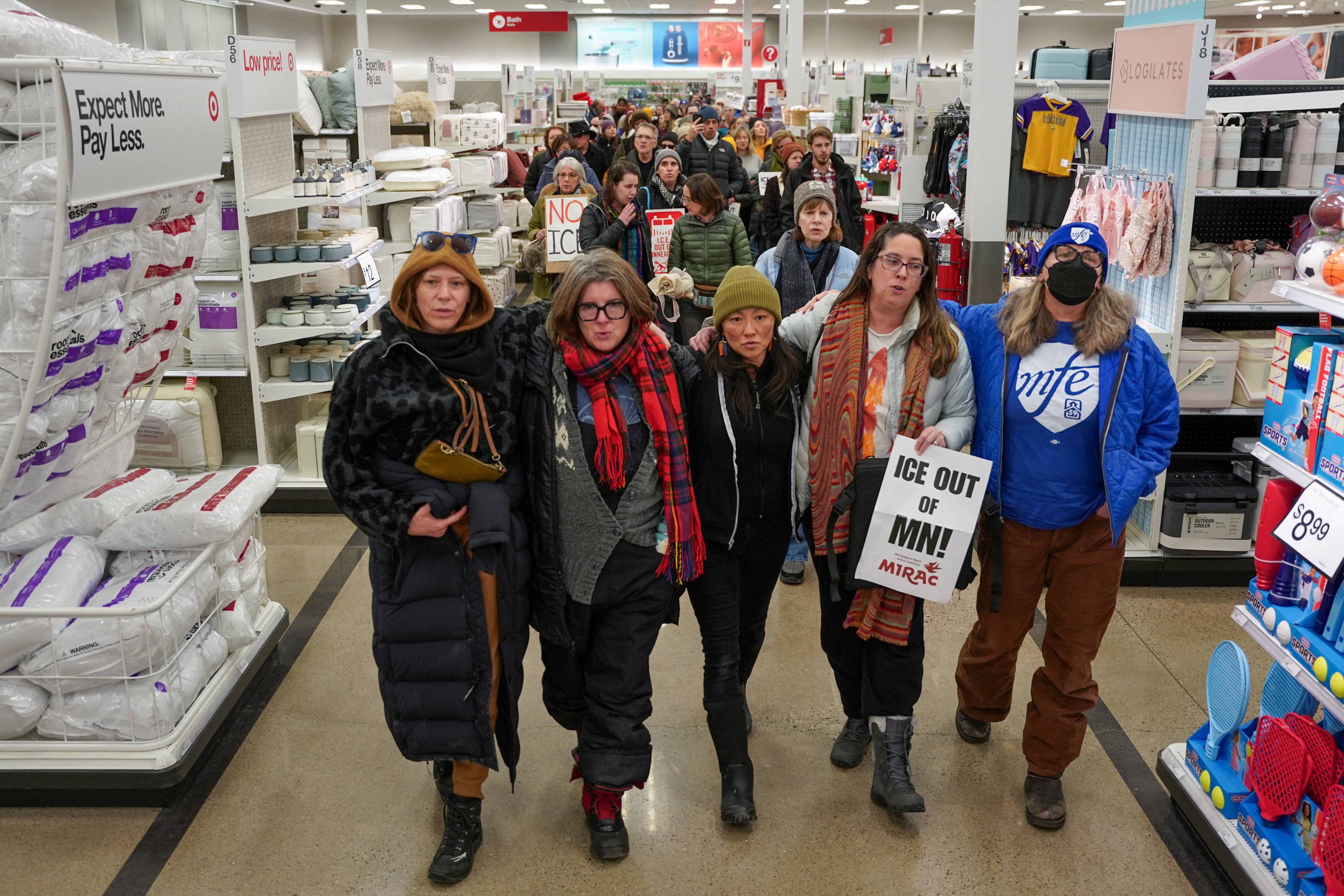 Protesters walk through a Target store as they stage a sit-in to rally against the U.S. Immigration and Customs Enforcement (ICE) and U.S. President Donald Trump's immigration policies, in south Minneapolis, Minnesota, U.S., January 31, 2026.