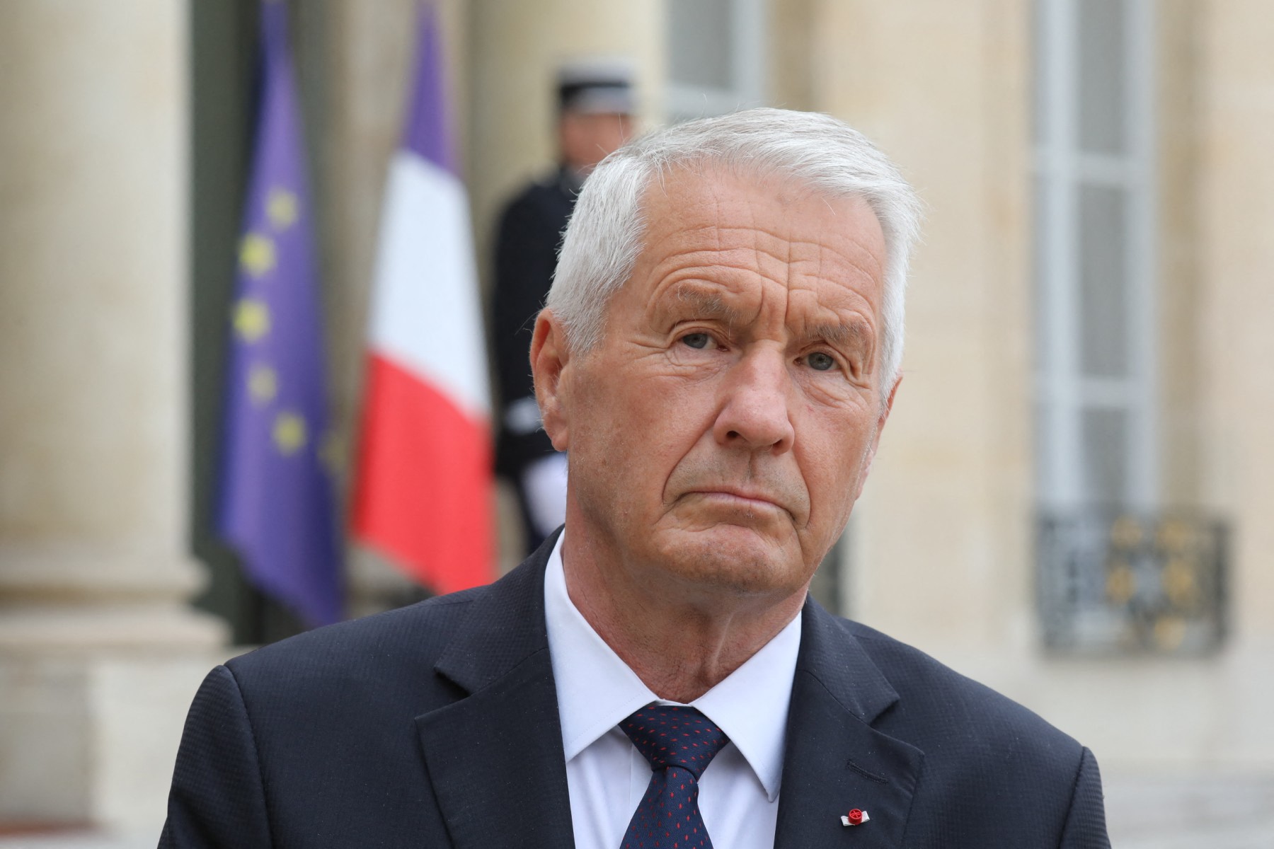 Thorbjørn Jagland looks on.
