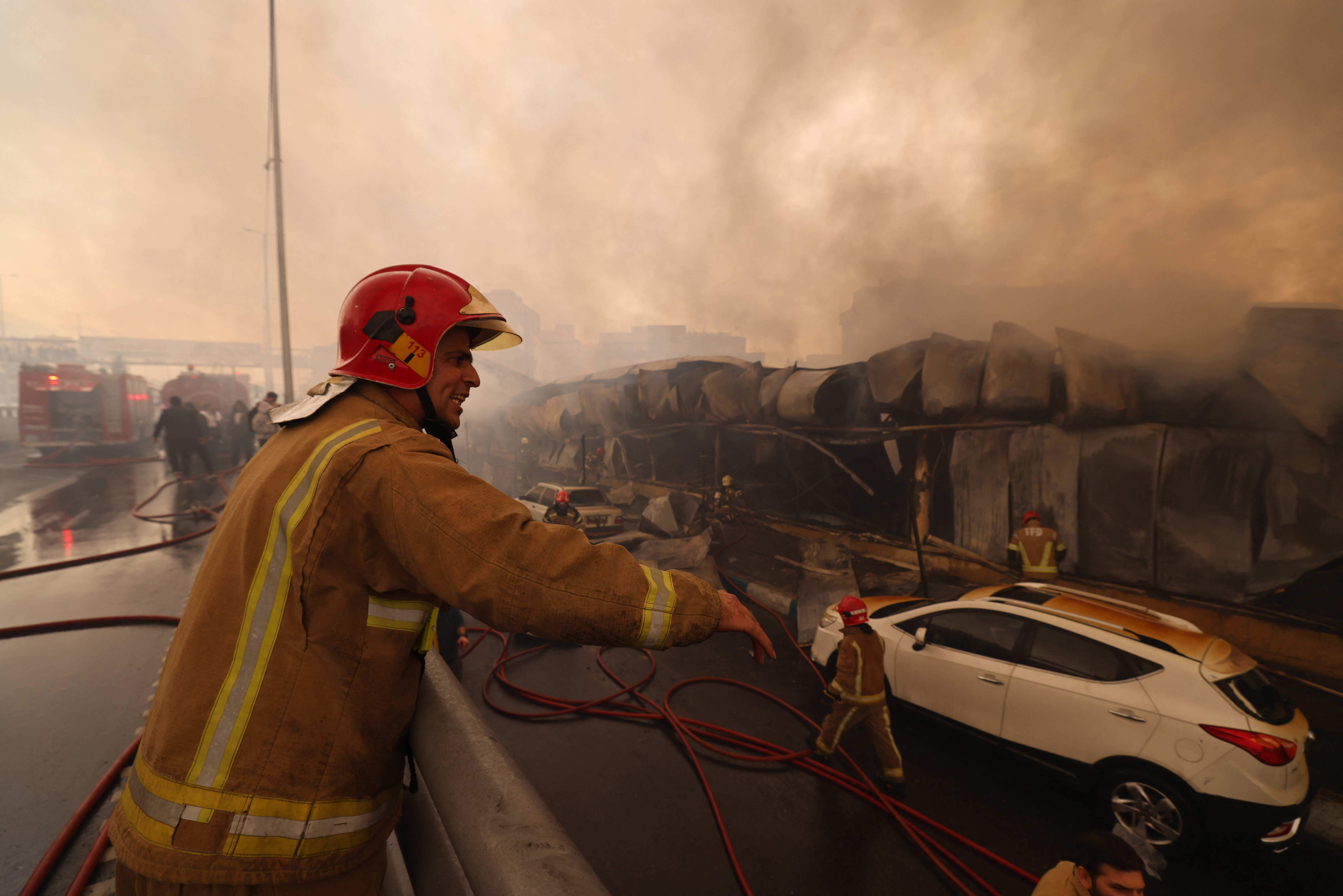Major Tehran bazaar fire that sent thick smoke over city is under control, with no injuries reported.