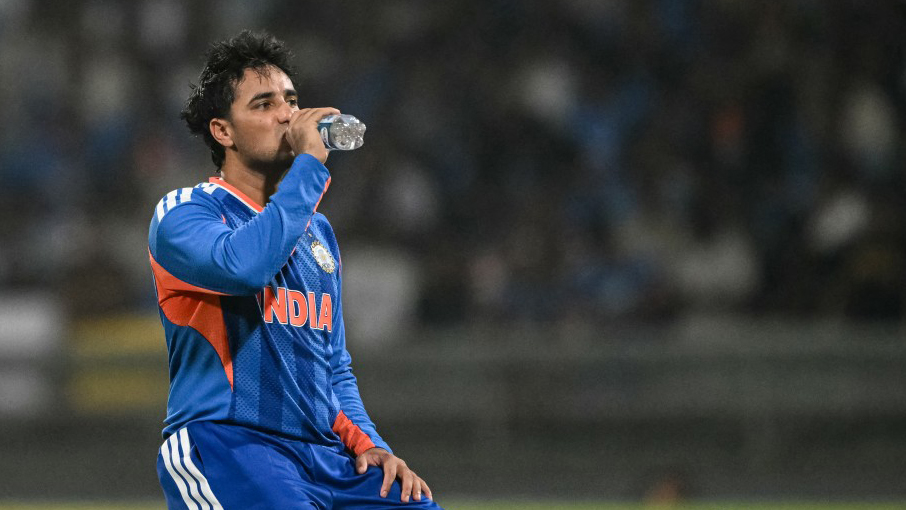 India's Abhishek Sharma drinks water during a break on the field.