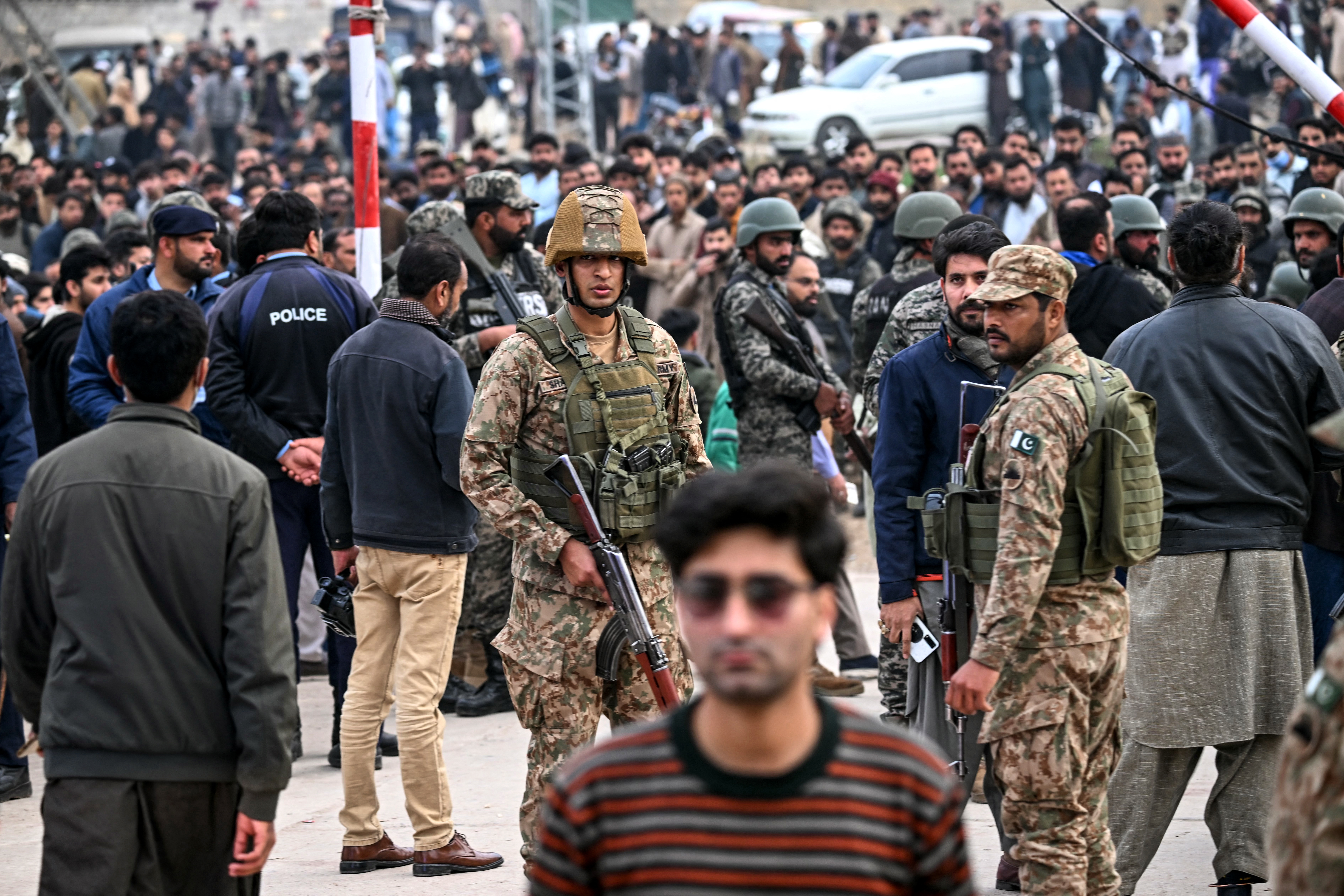 Security personnel stand guard outside a mosque following an explosion, in Islamabad on February 6, 2026. A blast at a Shiite mosque in Pakistan's capital Islamabad on February 6 killed 15 people and wounded at least 80, local authorities said. (Photo by Farooq NAEEM / AFP)