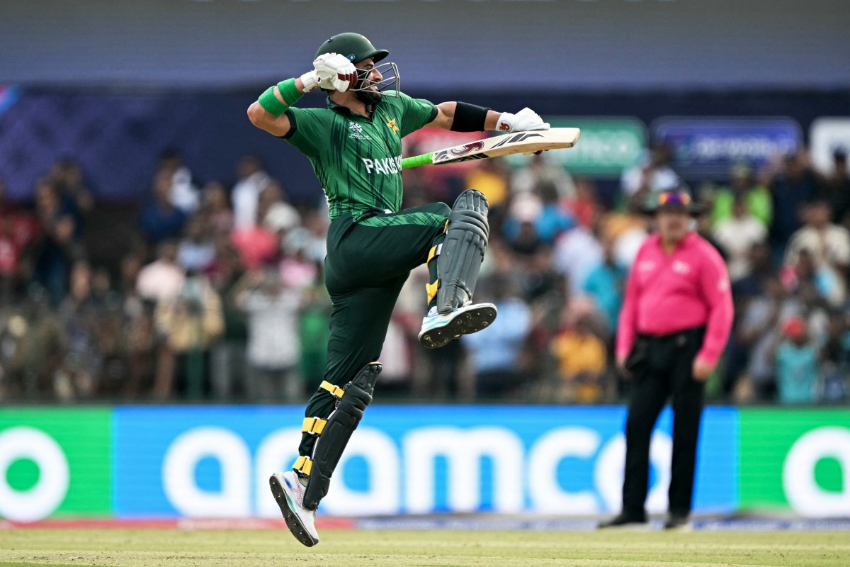Pakistan's Sahibzada Farhan celebrates after scoring a century (100 runs) during the 2026 ICC Men's T20 Cricket World Cup group stage match between Pakistan and Namibia
