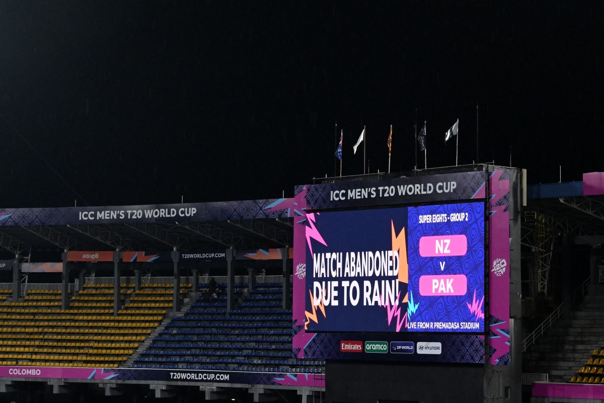 An electronic screen displays the match being abandoned due to rain.