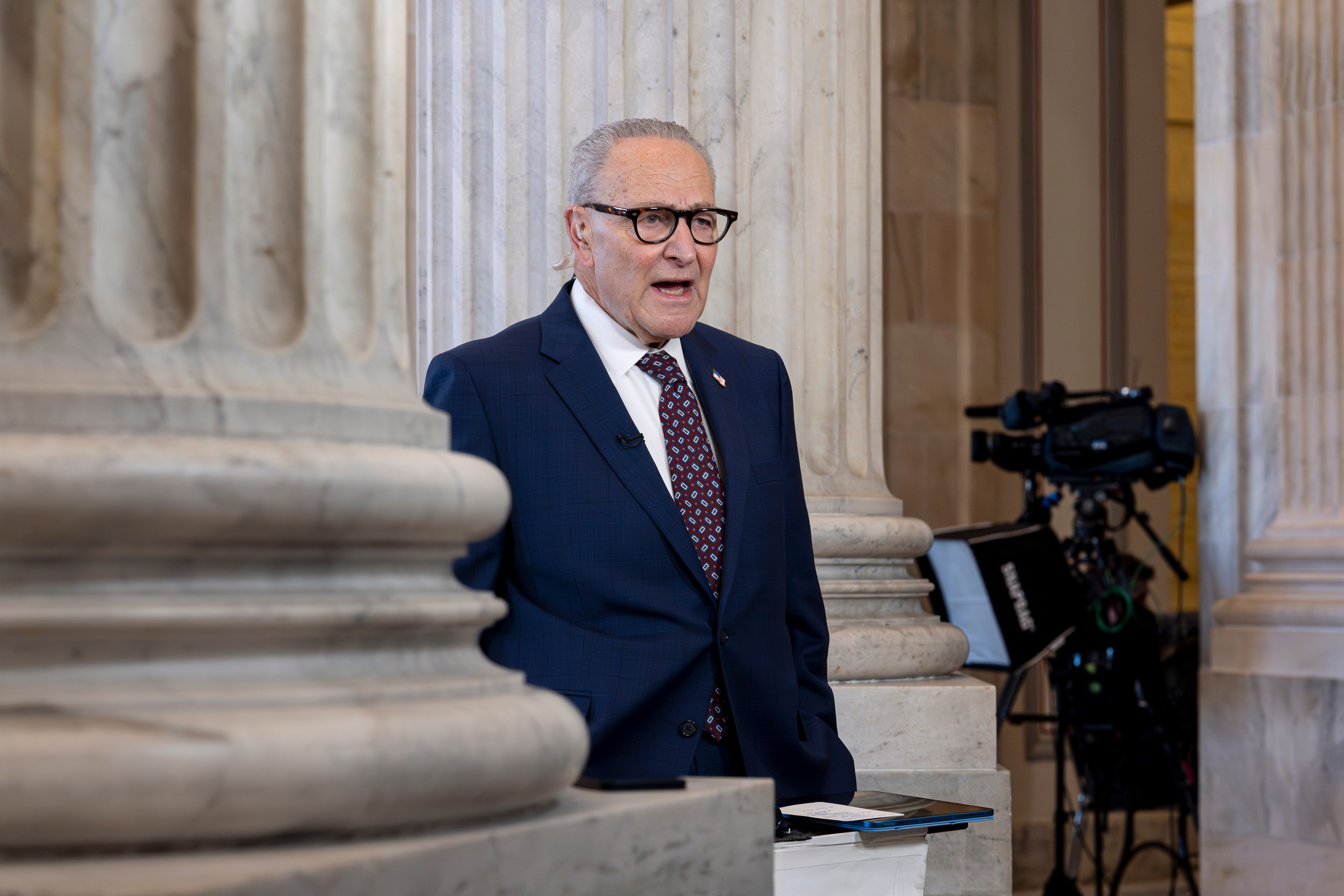 Chuck Schumer between columns in Congress