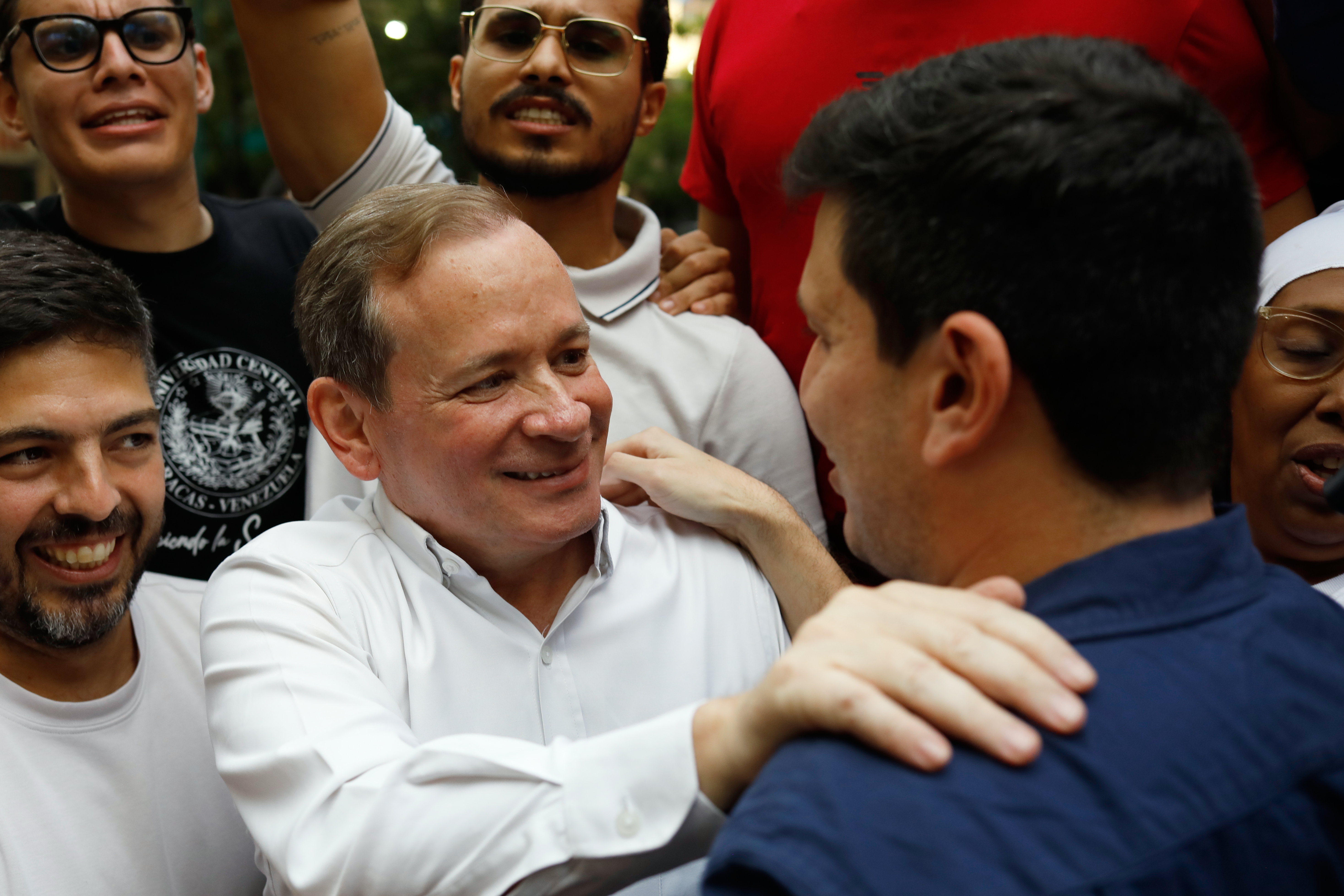 Opposition leader Juan Pablo Guanipa greets political activist Jesus Armas after their release