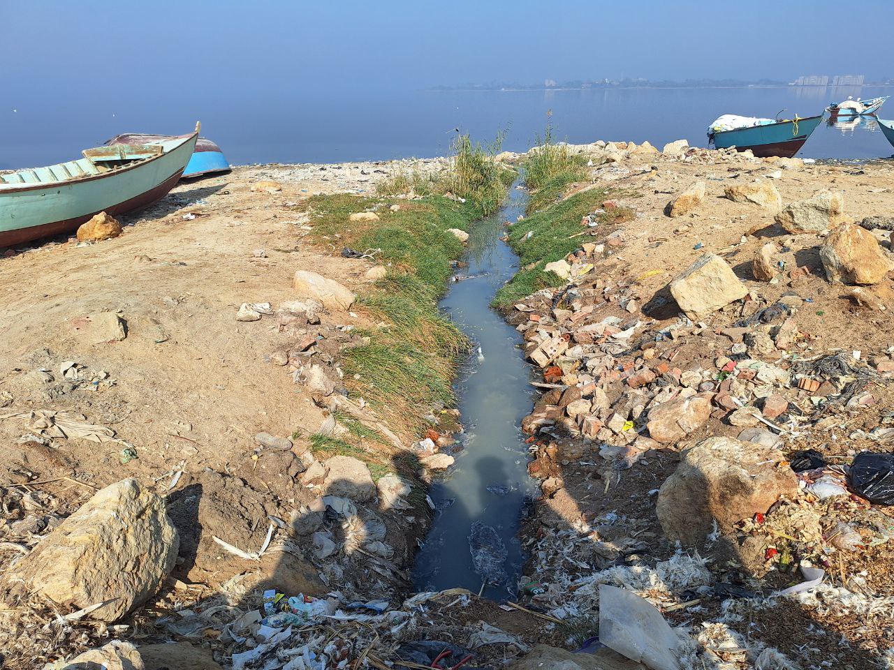 Sewage drainage channels run into the lake