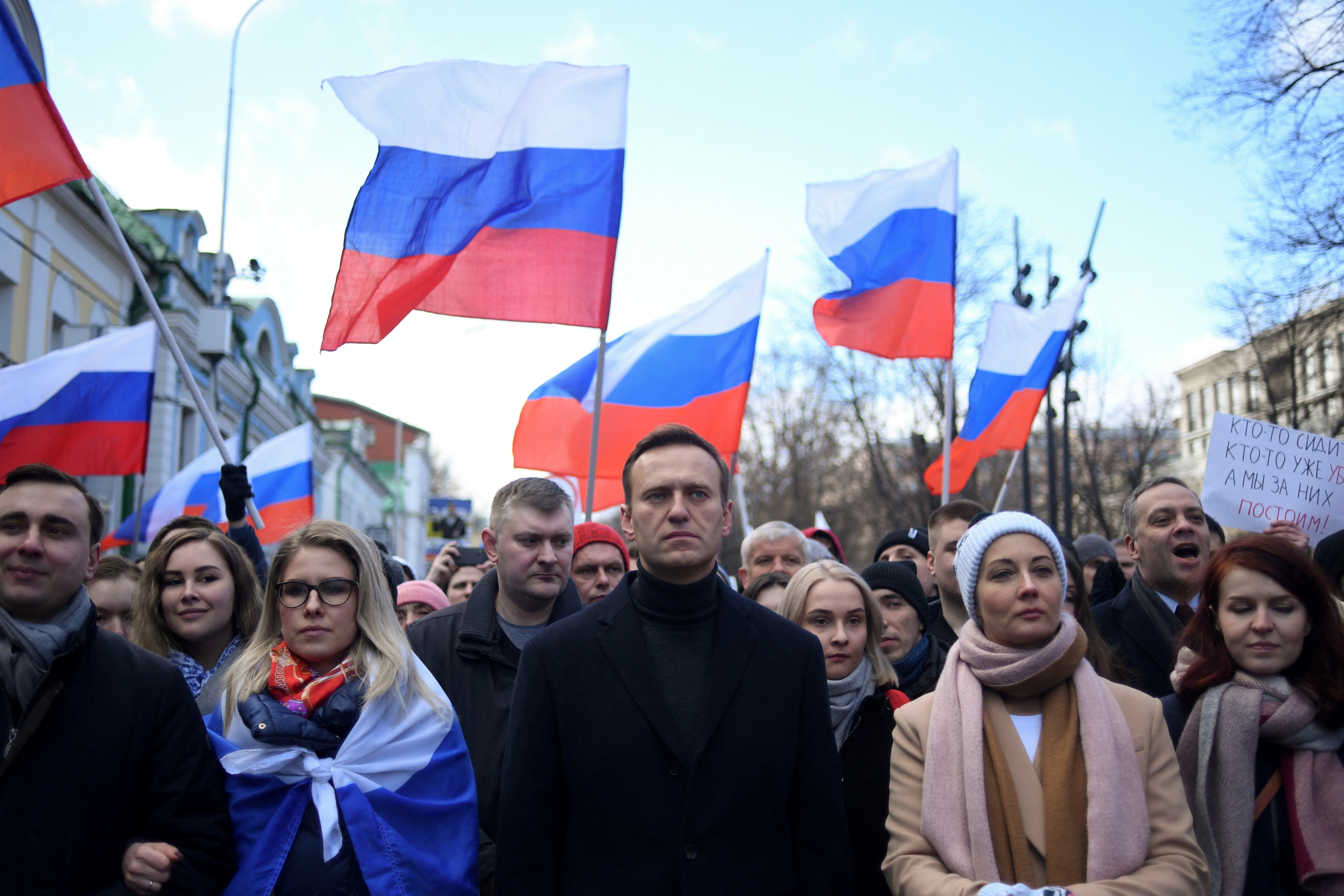 (FILES) Russian opposition leader Alexei Navalny, his wife Yulia, opposition politician Lyubov Sobol and other demonstrators march in memory of murdered Kremlin critic Boris Nemtsov in downtown Moscow on February 29, 2020.