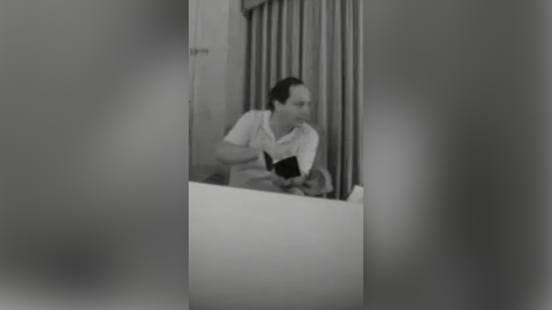 Former Jeffrey Epstein house manager Alfredo Rodriguez holds a book he claims contains the contact info of Epstein clients and victims. [Screenshot via FBI]