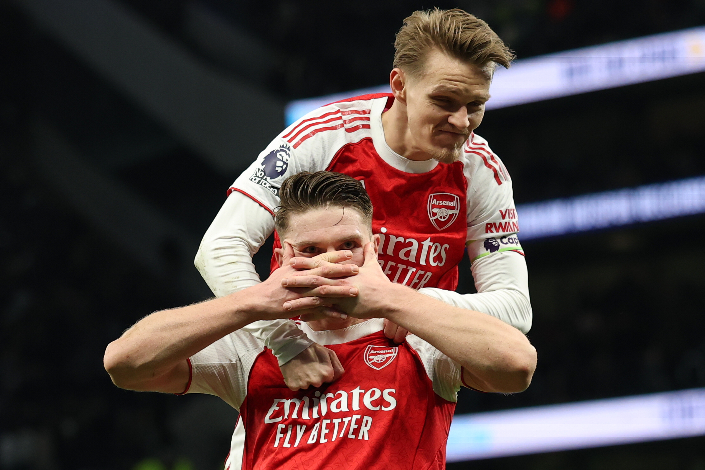Arsenal's Martin Odegaard, top,and Arsenal's Viktor Gyoekeres celebrate scoring their side's fourth goal during the English Premier League soccer match between Tottenham Hotspur and Arsenal in London, Sunday, Feb. 22, 2026.(AP Photo/Ian Walton)