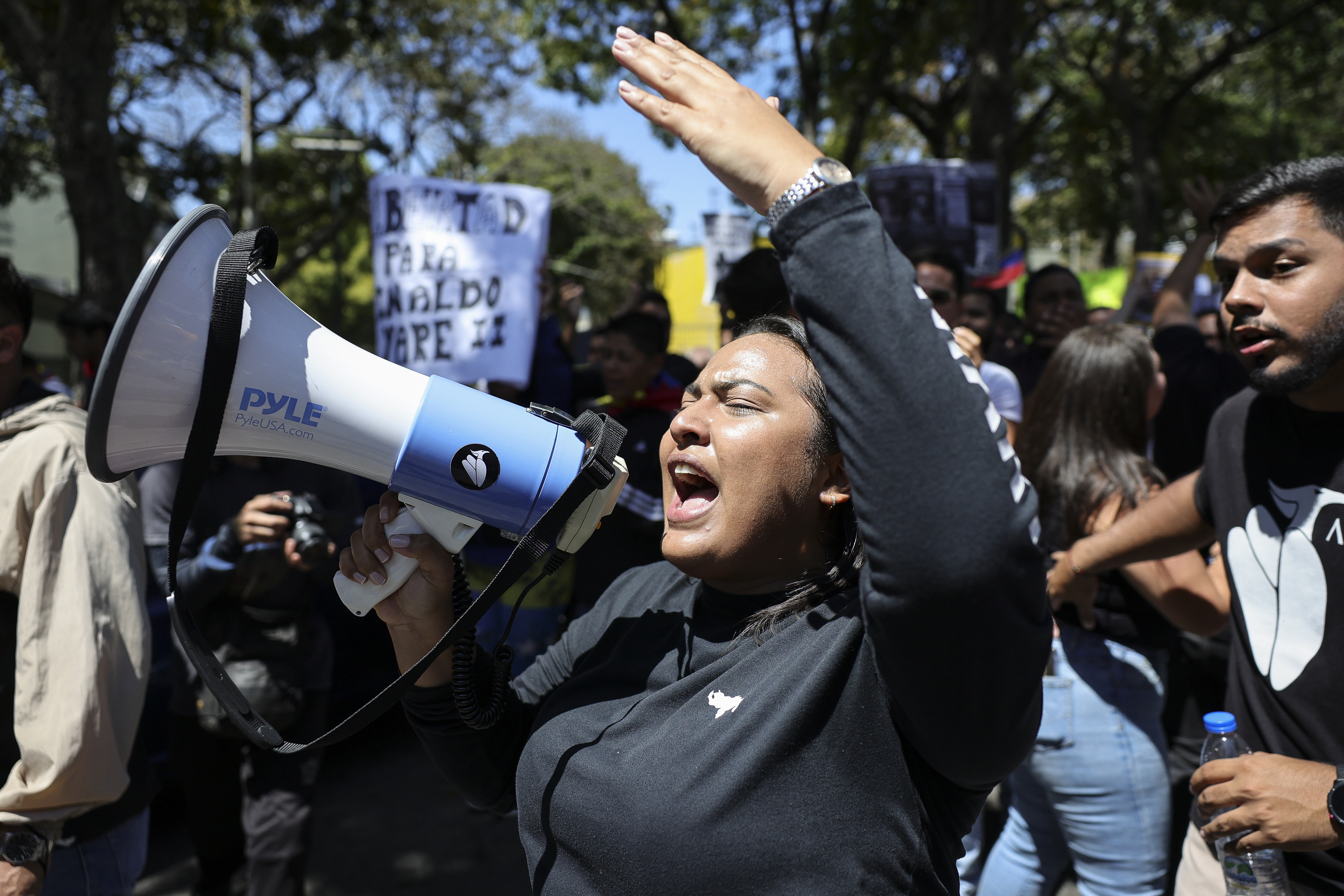 CARACAS, VENEZUELA - FEBRUARY 12: A university student shouts slogans through a megaphone during a protest as part of Venezuela's Youth Day on February 12, 2026 in Caracas, Venezuela. Every year, Venezuelans commemorate the youth day on February 12, remembering all young people who participated in the independence war. (Photo by Jesus Vargas/Getty Images)