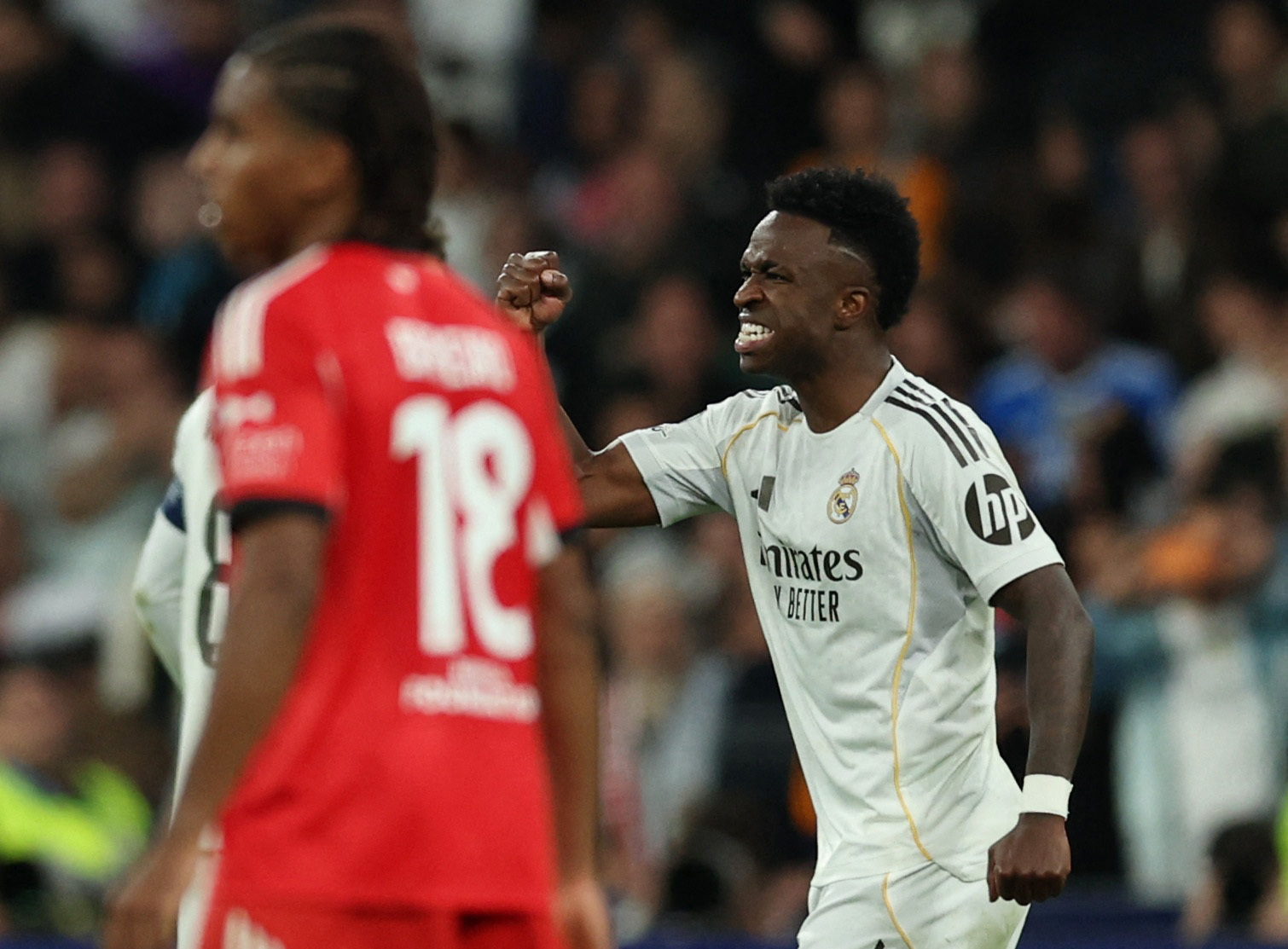 Soccer Football - UEFA Champions League - Play Off - Second Leg - Real Madrid v Benfica - Santiago Bernabeu, Madrid, Spain - February 25, 2026 Real Madrid's Vinicius Junior celebrates scoring their second goal REUTERS/Violeta Santos Moura