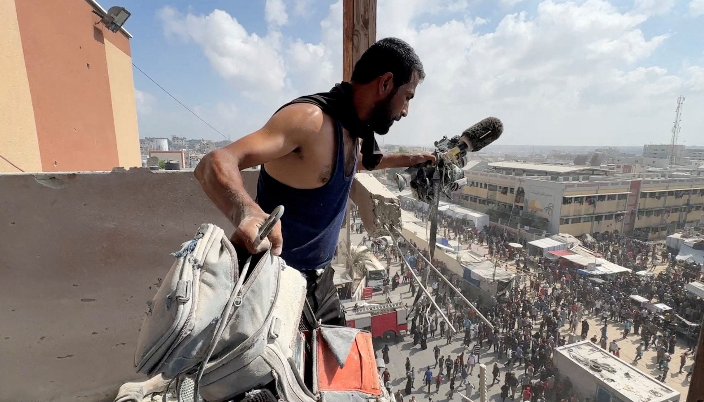 A man holds the equipment used by a cameraman in Israeli strikes on Nasser hospital, in Khan Younis in the southern Gaza Strip