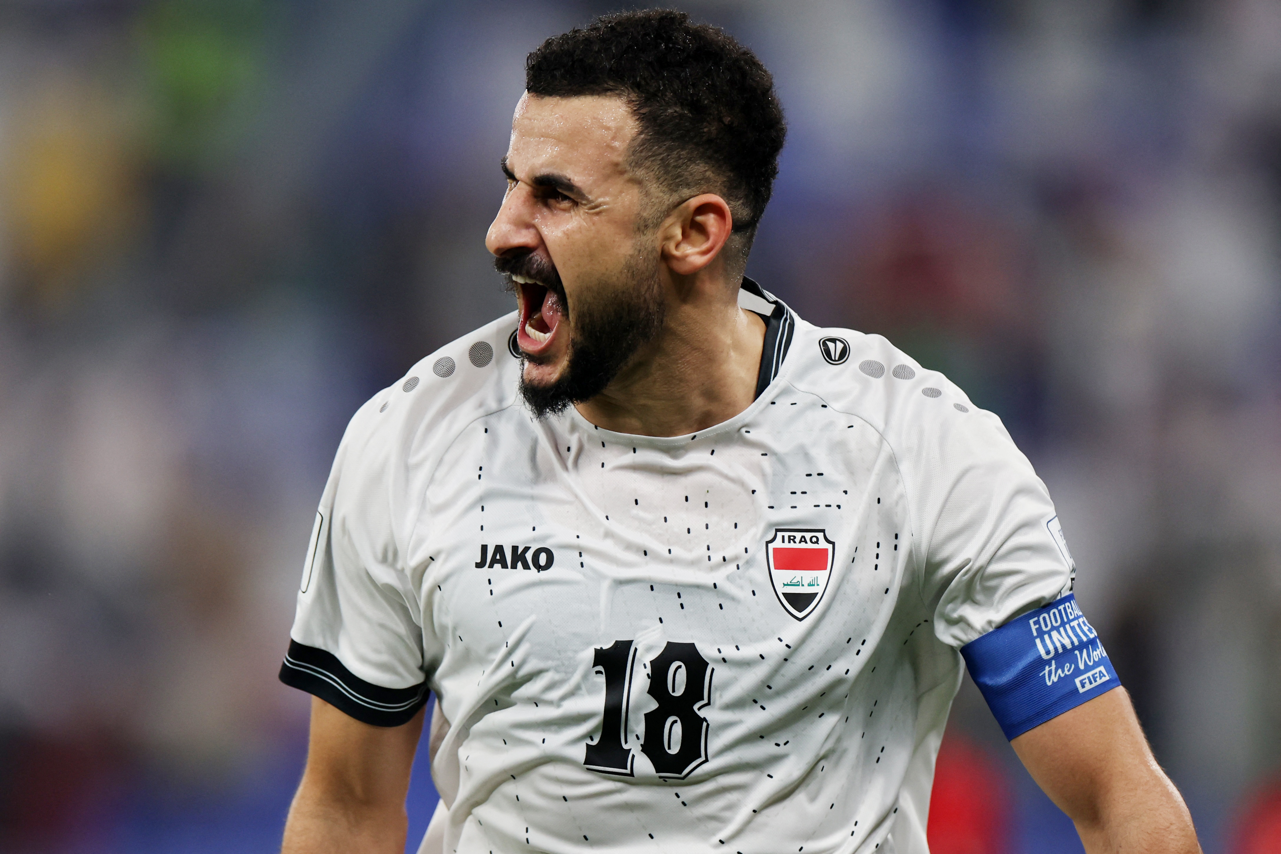 Soccer Football - FIFA Arab Cup - Qatar 2025 - Group D - Iraq v Bahrain - Stadium 974, Doha, Qatar - December 3, 2025 Iraq's Aymen Hussein celebrates scoring their first goal REUTERS/Thaier Al-Sudani