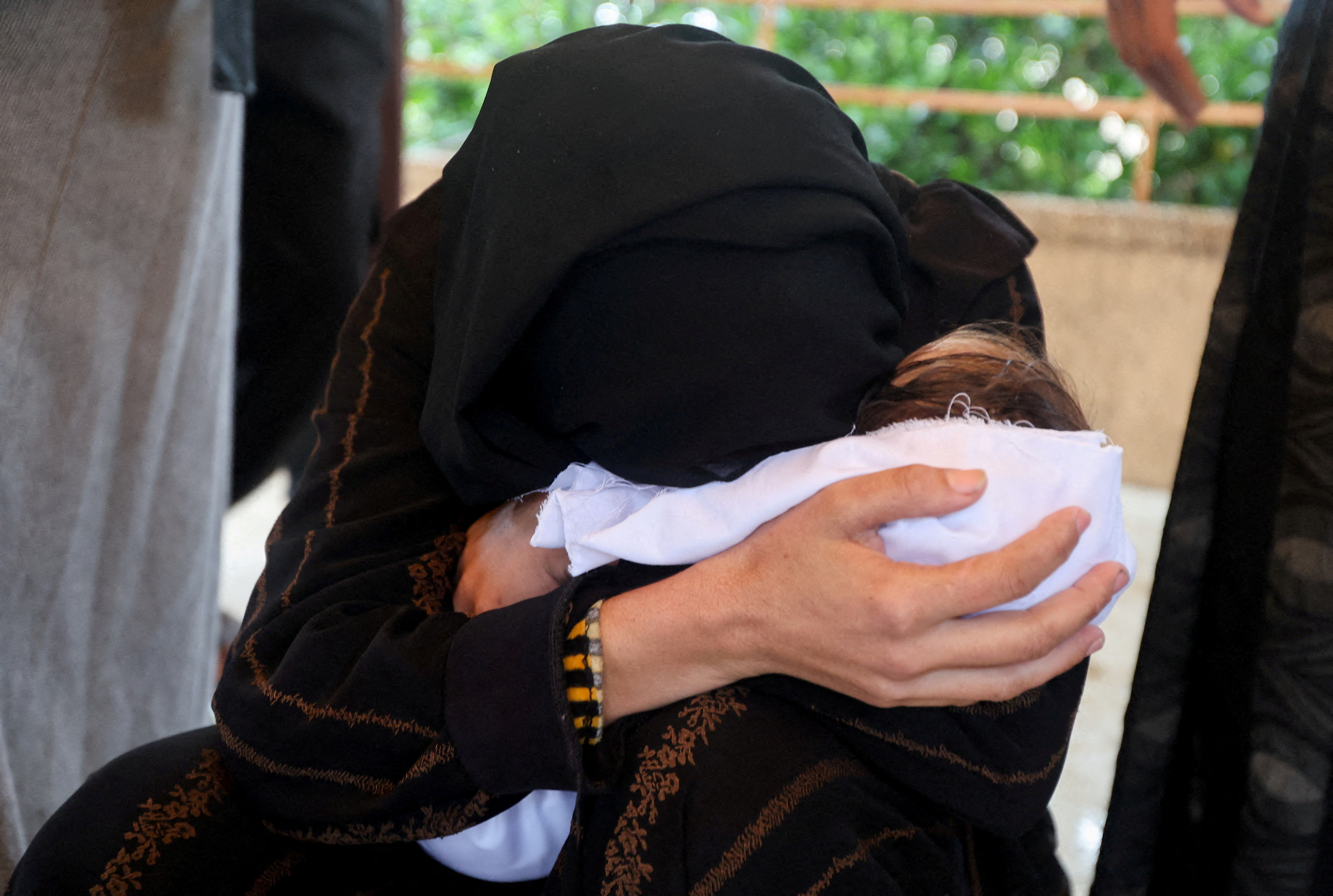 A Palestinian mother mourns her baby daughter Rahaf Abu Jazar