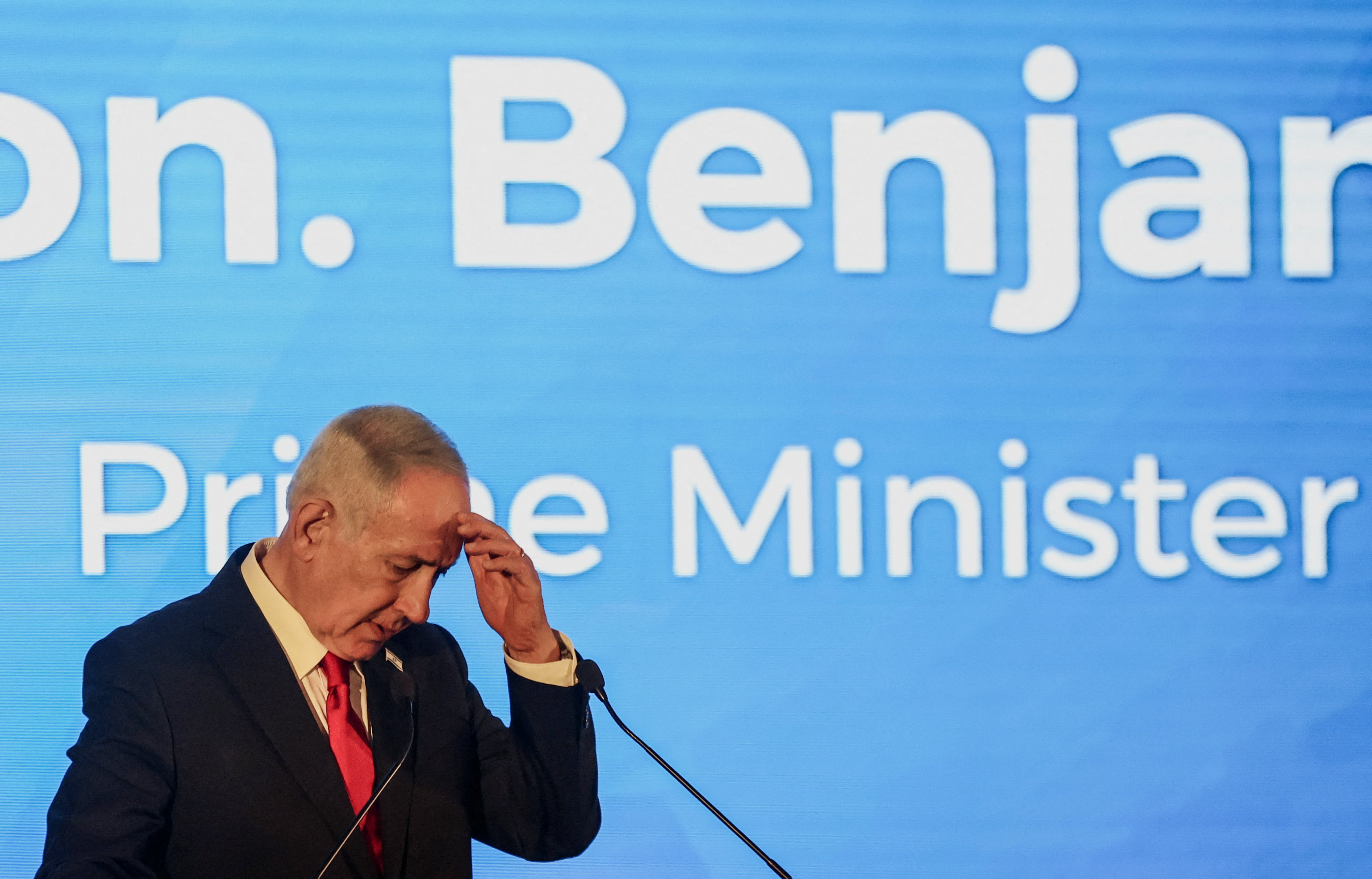 Israeli Prime Minister Benjamin Netanyahu gestures as he speaks during a conference.