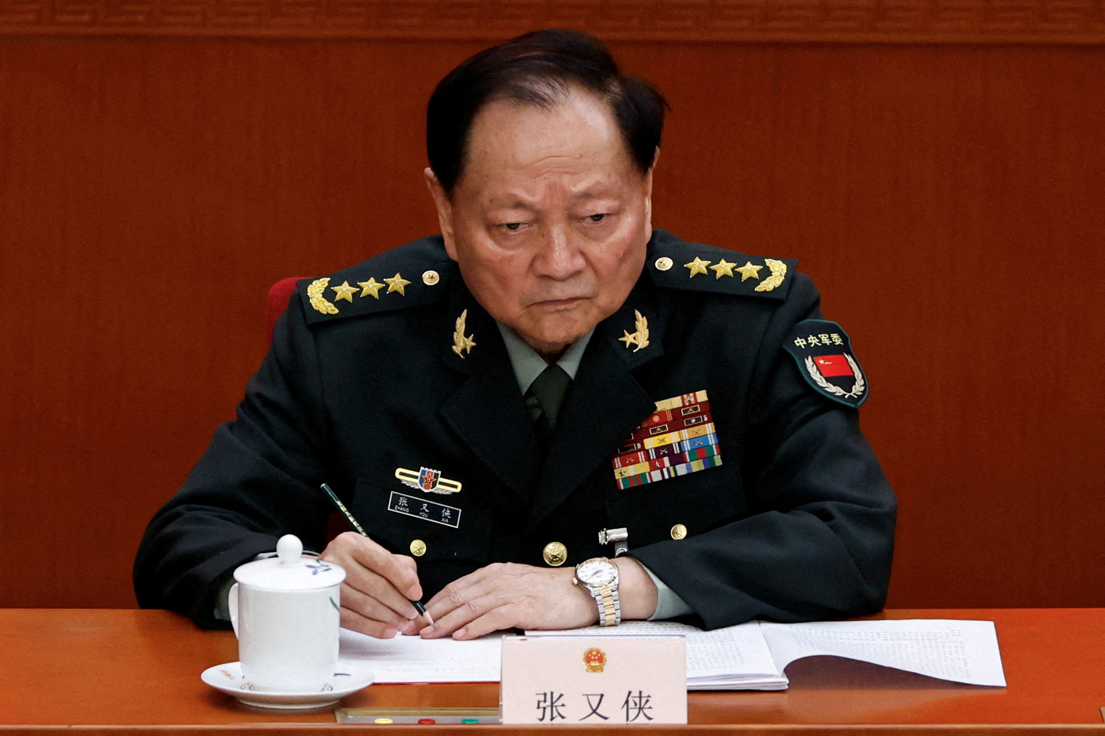 FILE PHOTO: FILE PHOTO: Central Military Commission Vice Chairman Zhang Youxia attends the second plenary session of the National People's Congress (NPC), at the Great Hall of the People in Beijing, China March 8, 2025. REUTERS/Tingshu Wang/File Photo/File Photo