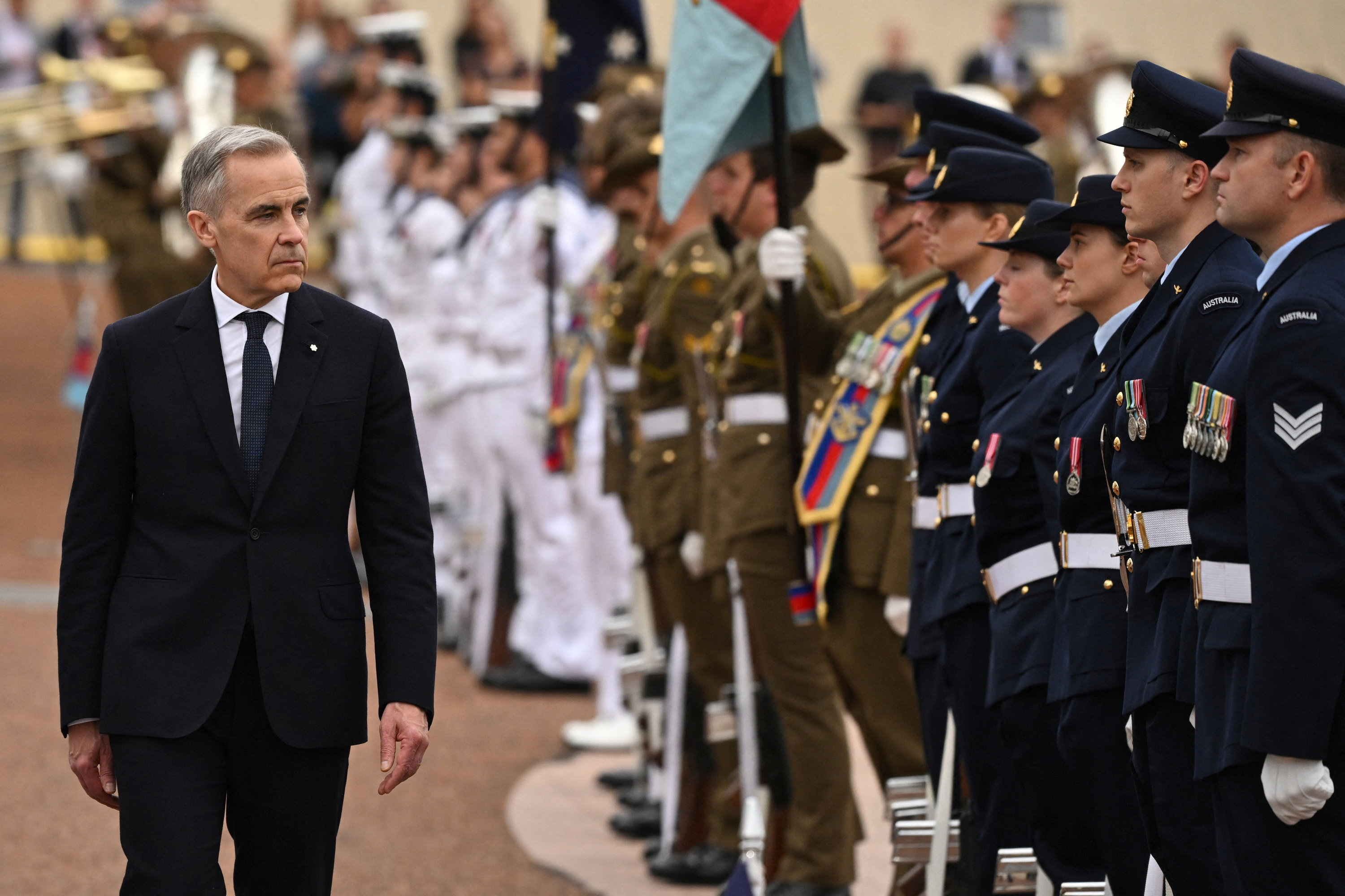 Prime Minister of Canada Mark Carney receives a ceremonial welcome at the Australian Parliament House, in Canberra, Australia, March 5, 2026. AAP/Lukas Coch via REUTERS ATTENTION EDITORS - THIS IMAGE WAS PROVIDED BY A THIRD PARTY. NO RESALES. NO ARCHIVE. AUSTRALIA OUT. NEW ZEALAND OUT. NO COMMERCIAL OR EDITORIAL SALES IN NEW ZEALAND. NO COMMERCIAL OR EDITORIAL SALES IN AUSTRALIA.